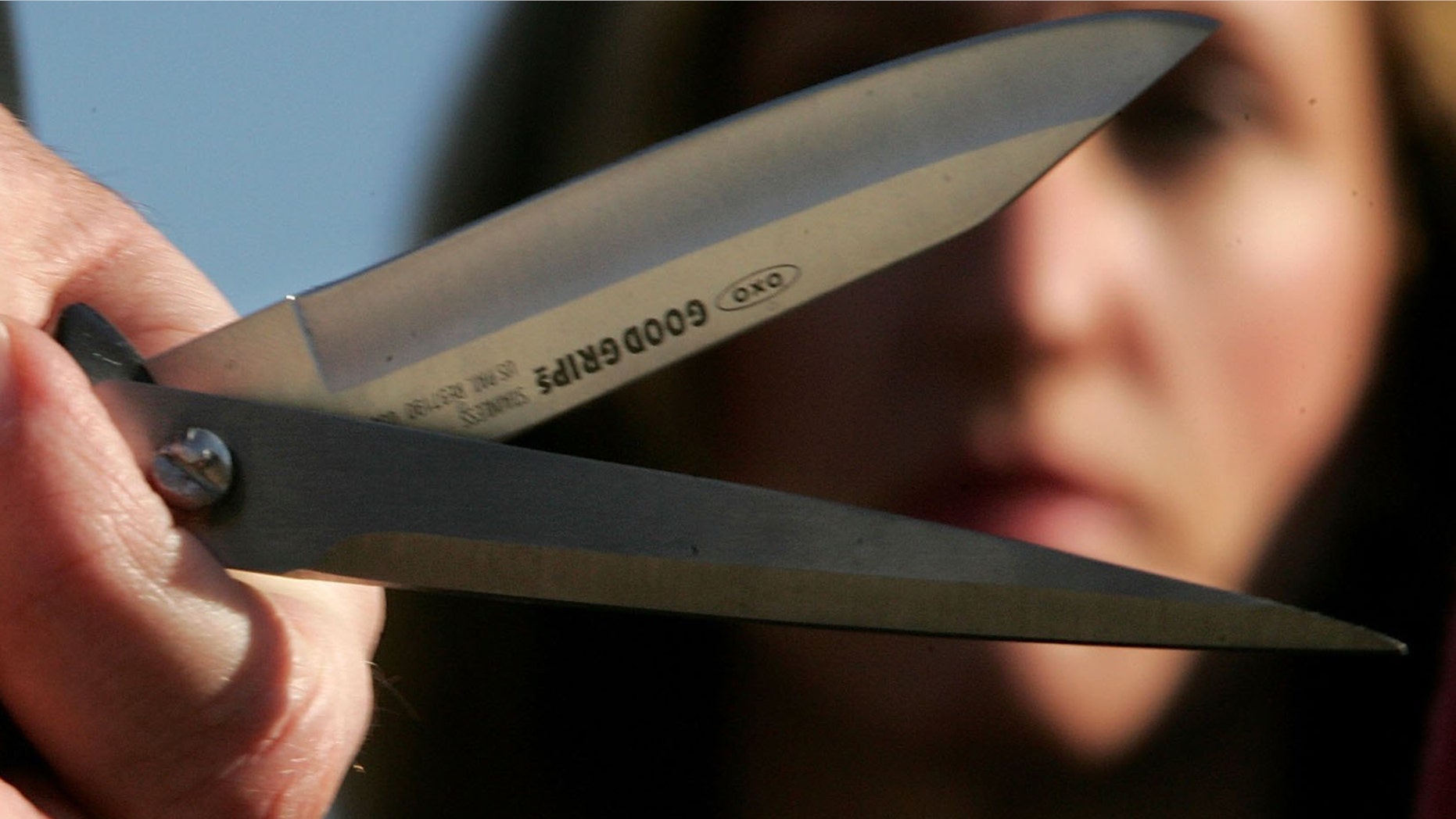 WASHINGTON - JANUARY 30: As a flight attendant looks on, U.S. Representative Edward Markey (D-MA) holds a pair of blades, one a knife, the other from a pair of scissors, at a media conference marking a "National Day of Action" by the Association of Flight Attendants at Reagan National Airport January 30, 2006 just outside Washington, DC. Representative Markey is promoting legislation that would reverse a recent decision by the Transportation Security Administration that would allow "dangerous sharp objects" banned after 9/11 back onto passenger planes. (Photo by Win McNamee/Getty Images)