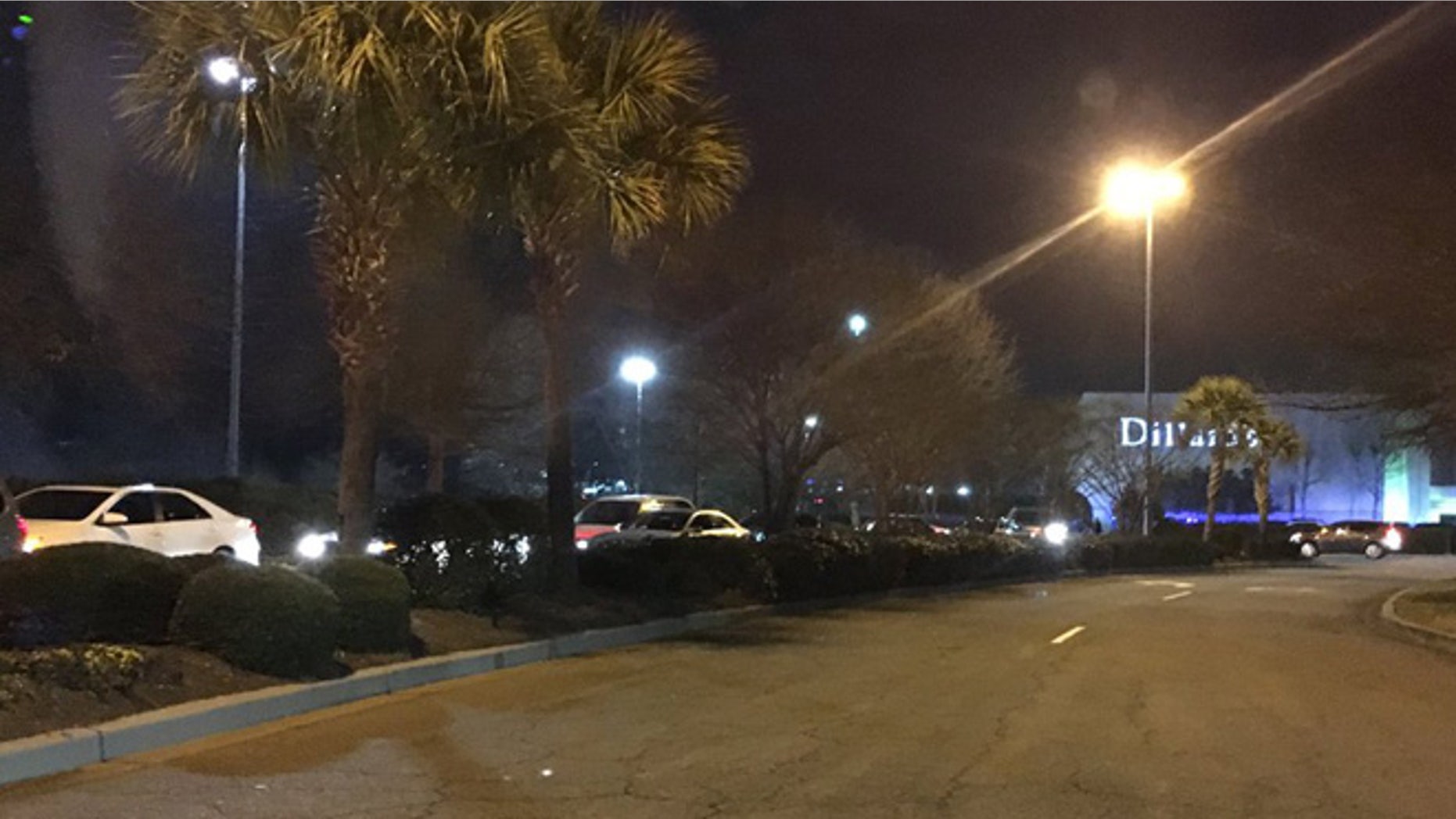 Shoppers exit the grounds of the Columbiana Mall at Harbison in Columbia, S.C. after reports of an active shooter (Wayne Shuler)