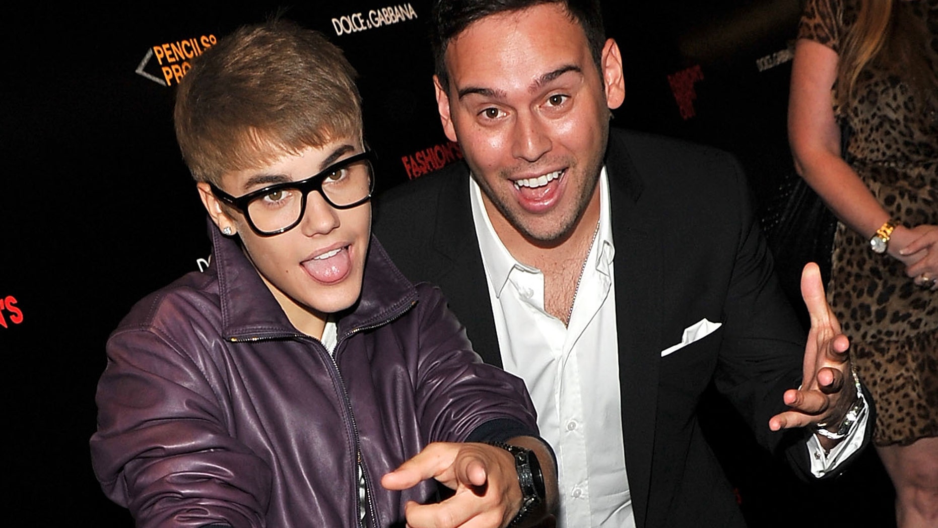 Justin Bieber and Scooter Braun (Photo by Stephen Lovekin/Getty Images for Dolce & Gabbana)