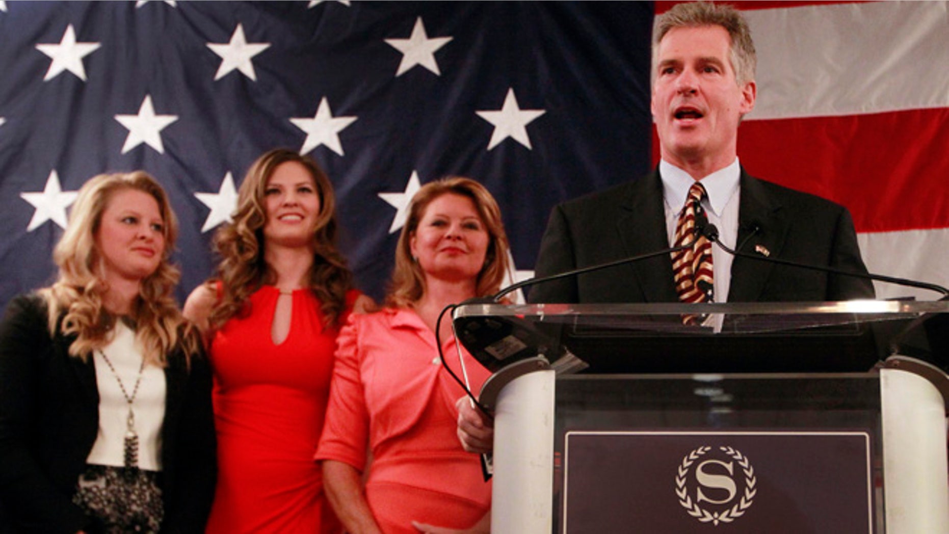 April 10, 2014: With his family at his side, daughters Arianna, left, and Ayla, and his wife Gail, former Mass. U.S. Senator Scott Brown announces his plans to run for the U.S. Senate in New Hampshire.