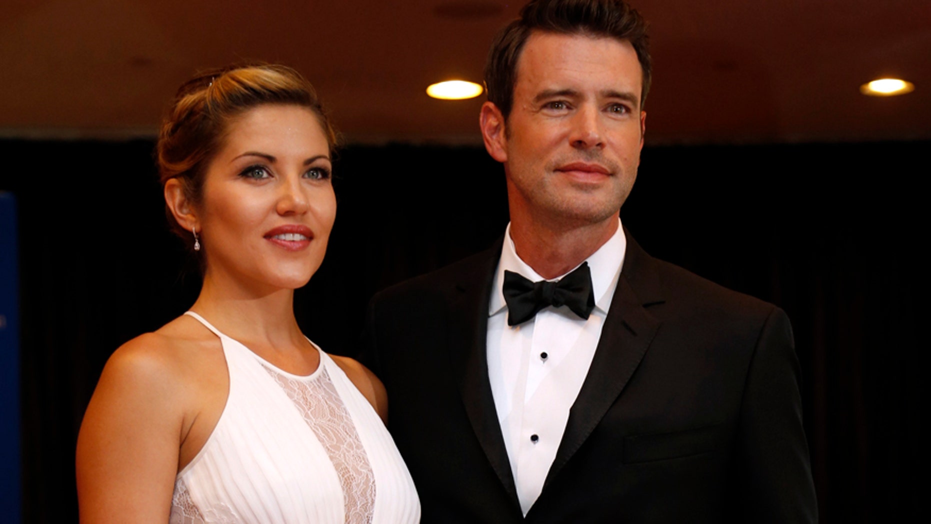 Actor Scott Foley and his wife, Marika Dominczyk, arrive on the red carpet at the annual White House Correspondents' Association Dinner in Washington, May 3, 2014.