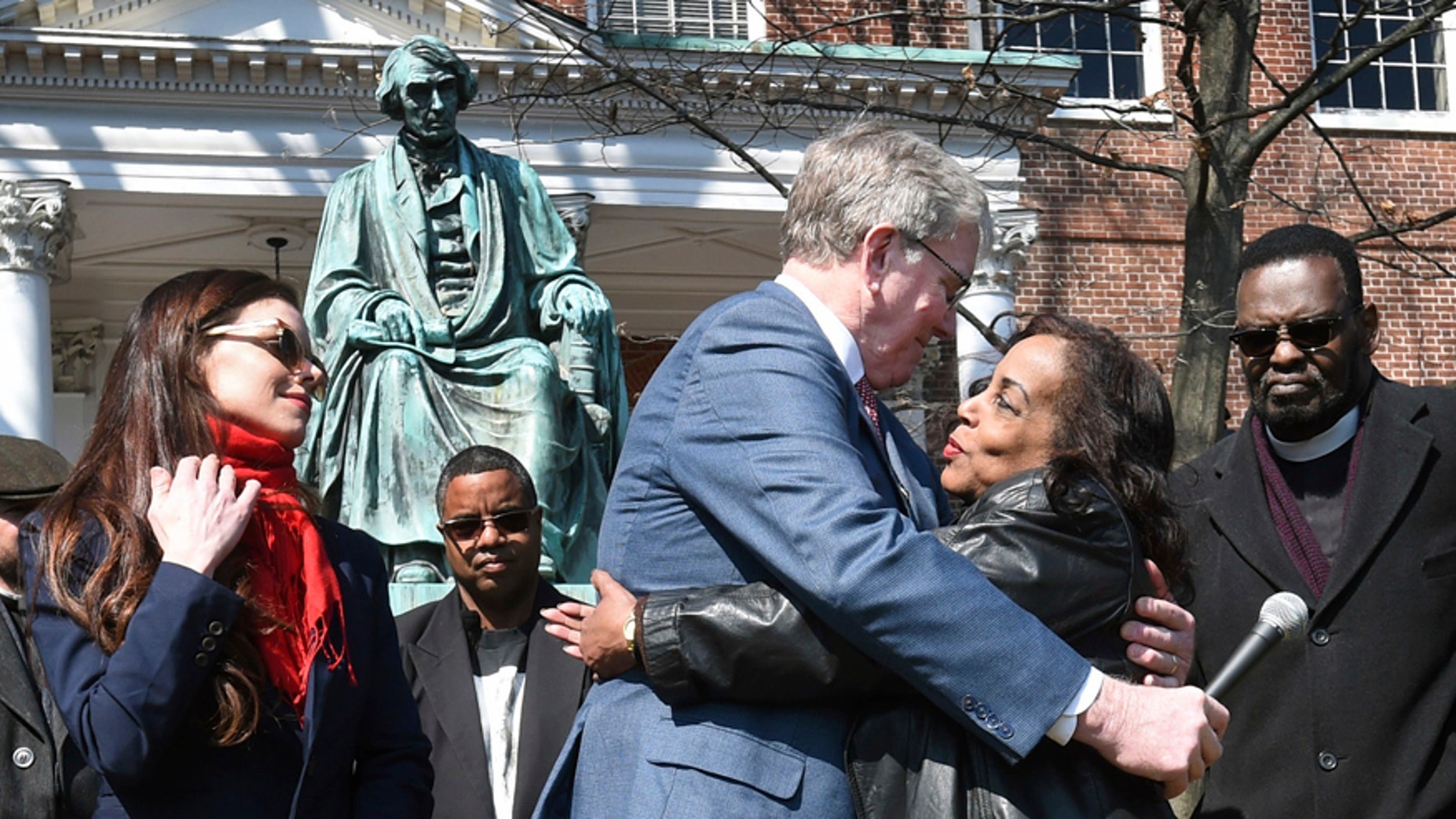 Lynne Jackson, a descendant of Dred Scott, right, hugs Charles Taney III, a descendant of U.S. Supreme Court Chief Justice Roger Taney on the 160th anniversary of the Dred Scott decision in front of the Maryland State House, Monday, March 6, 2017, in Annapolis, Md.