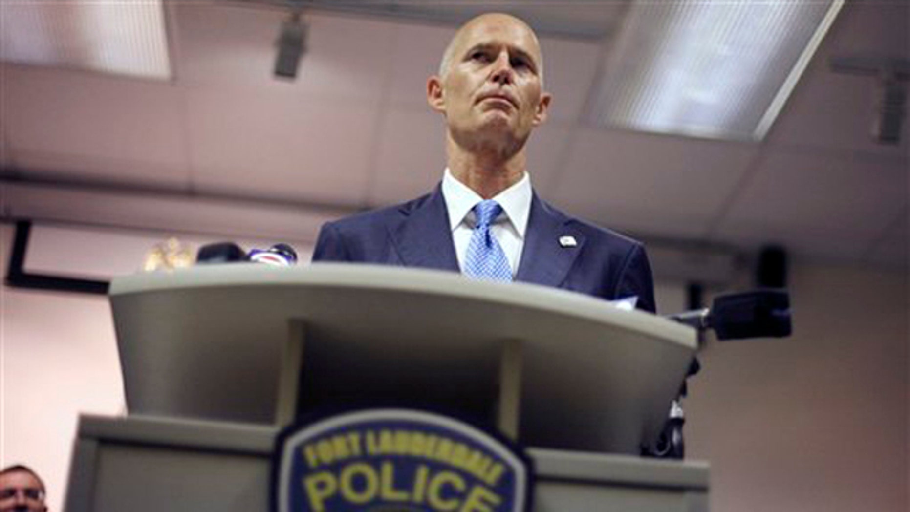 Florida Gov. Rick Scott is shown at a ceremony at a Fort Lauderdale, Fla., police station June 3.