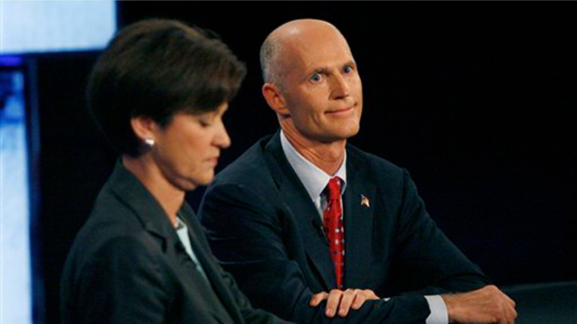 Democratic candidate Alex Sink, left, and Republican candidate Rick Scott participate in a gubernatorial debate Oct. 25 in Tampa, Fla. (AP Photo)