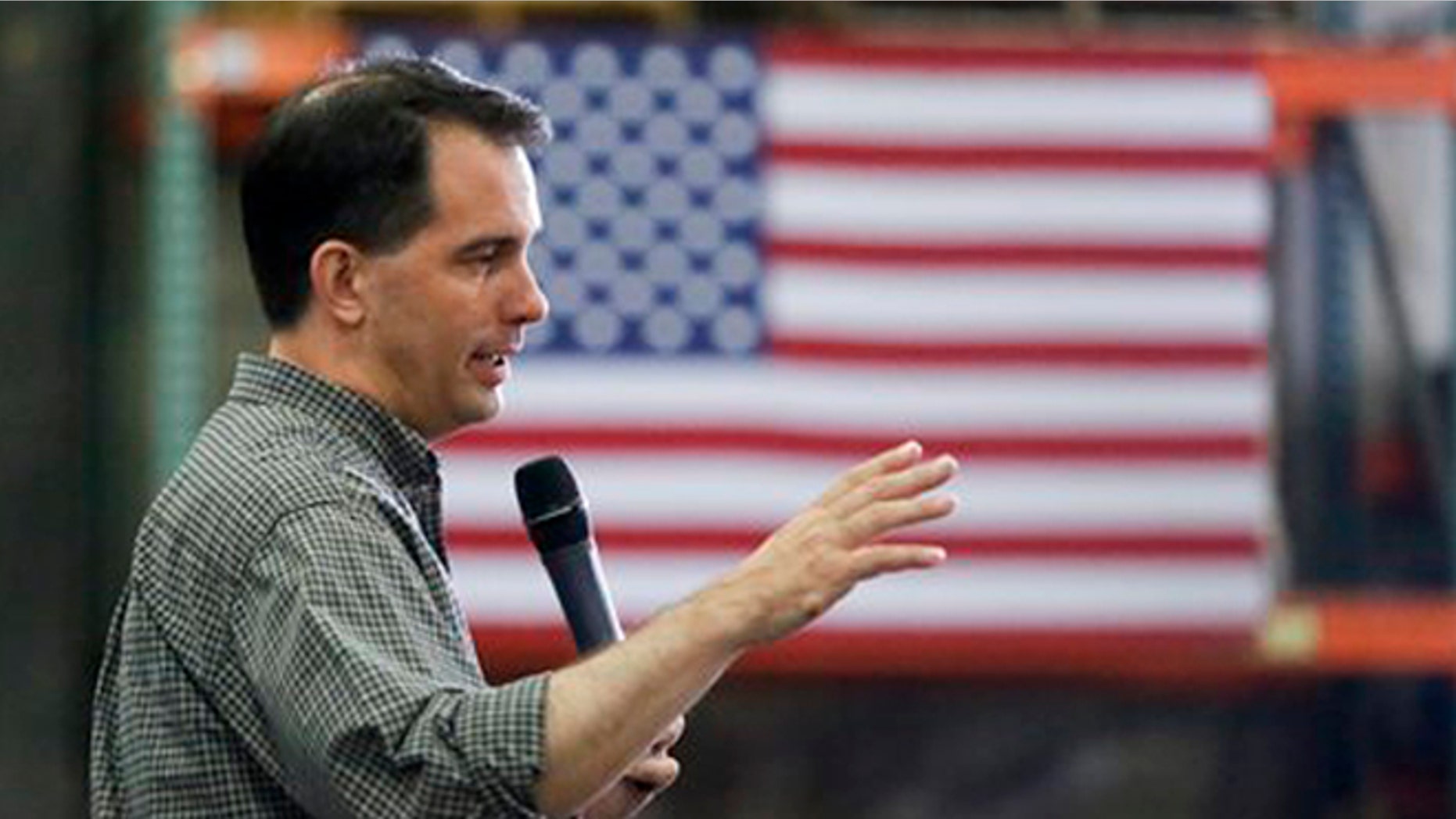Republican presidential candidate Wisconsin Gov. Scott Walker addresses a crowd at Giese Manufacturing, Sunday, July 19, 2015, in Dubuque, Iowa.