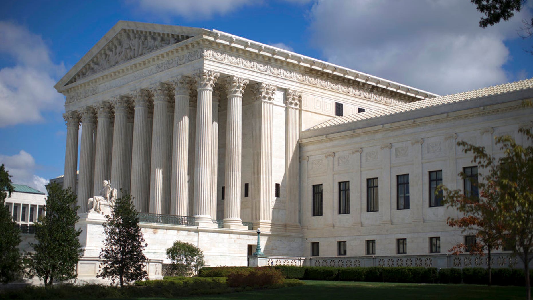 FILE - In this Oct. 5, 2015 file photo, the Supreme Court is seen in Washington. President Donald Trump has said he plans to pick a young Supreme Court justice who could be on the court for 40 years or more. But other factors will also be in play as the candidates are vetted: their ideological bent, gender, ability to be confirmed and even whether they meet Trumpâs requirement that they be ânot weak.â (AP Photo/Carolyn Kaster, File)