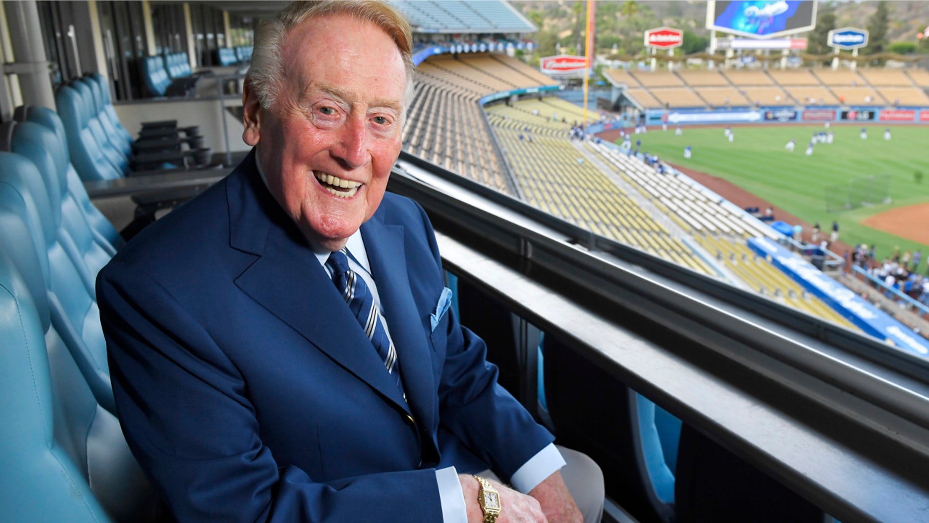 Sept. 20, 2016: Hall of Fame broadcaster Vin Scully poses for a photo prior a baseball game between the Los Angeles Dodgers and the San Francisco Giants in Los Angeles. His final game at Dodger Stadium - where he has described nearly 5,000 games over the years - will be Sunday against the Rockies.