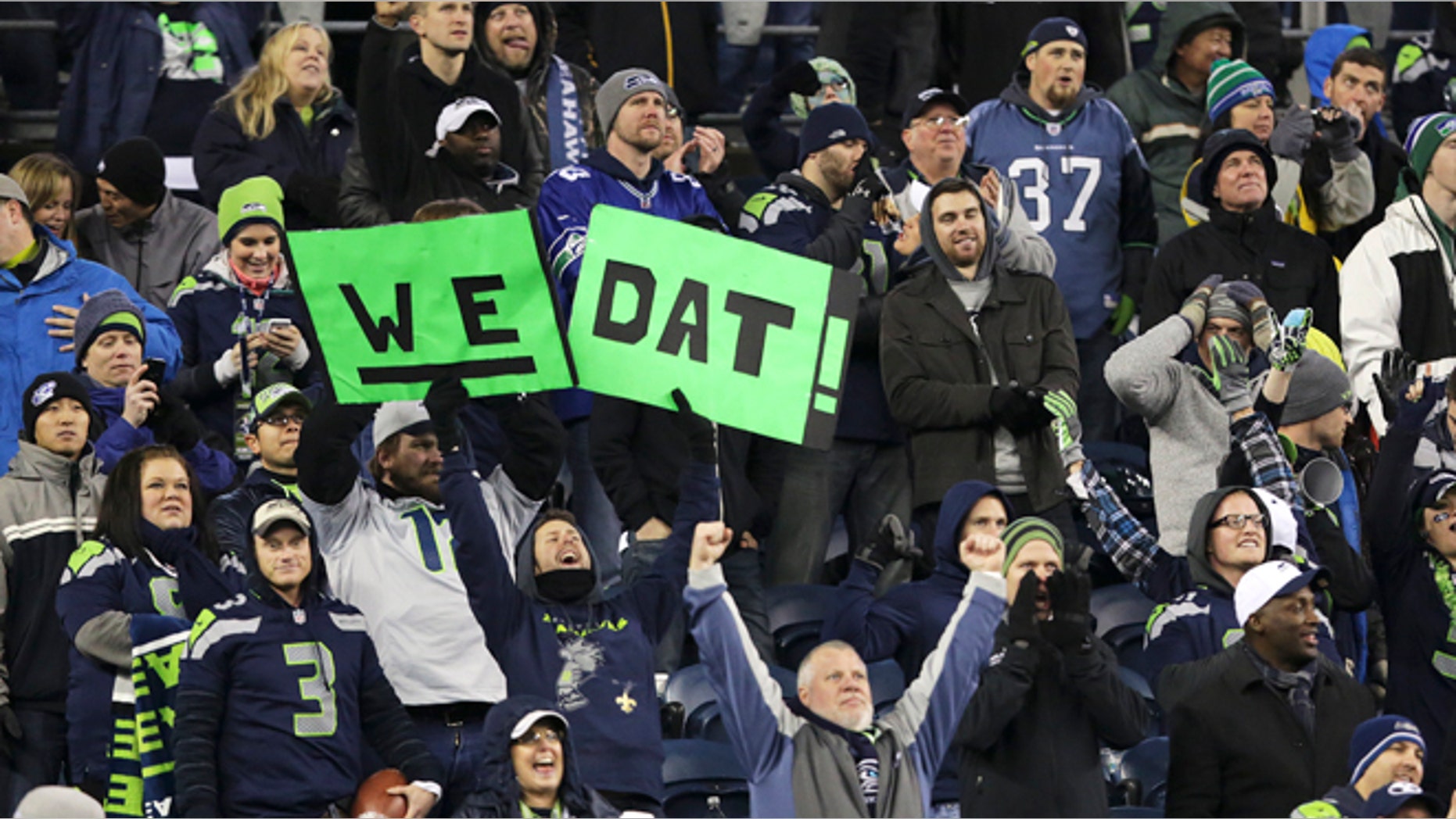 Dec. 2, 2013: Seattle Seahawks fans celebrate with a variation on the New Orleans Saints slogan 'Who Dat?' in the second half of an NFL football game, Monday, Dec. 2, 2013, in Seattle. The Seahawks beat the Saints 34-7. (AP/Scott Eklund)