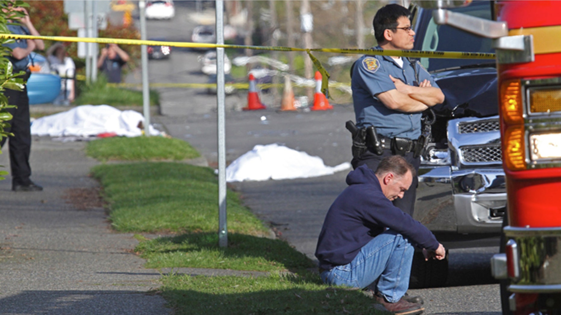 March 25: A pickup struck four pedestrians crossing a Seattle street Monday, killing two and critically injuring two others, police said. The driver, sitting, Mark W. Mullan, 50, of Seattle, was booked into the King County Jail for investigation of vehicular homicide, jail records showed.