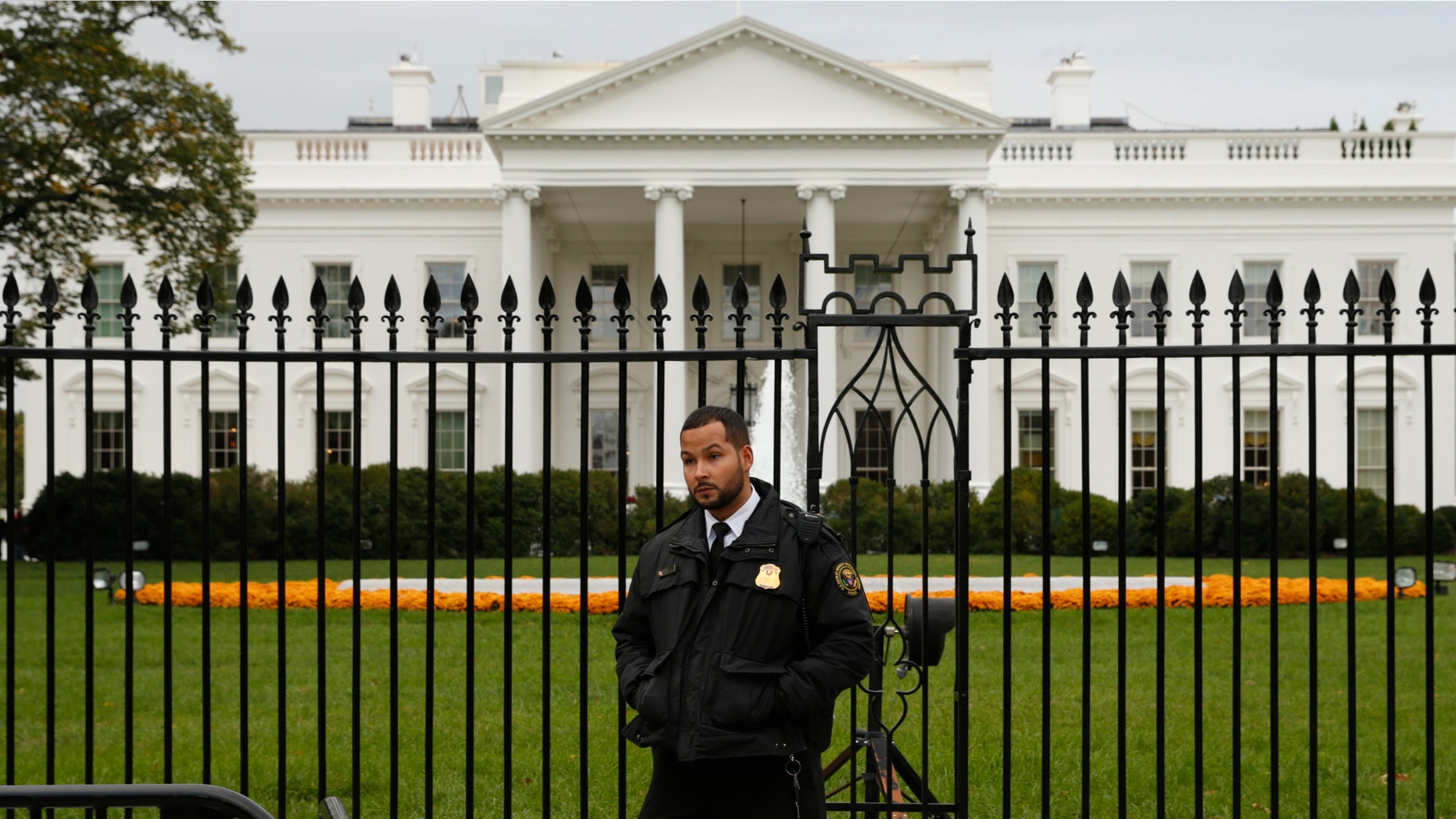 Oct. 23, 2014: A member of the U.S. Secret Service stands guard in front of the North Lawn of the White House in Washington