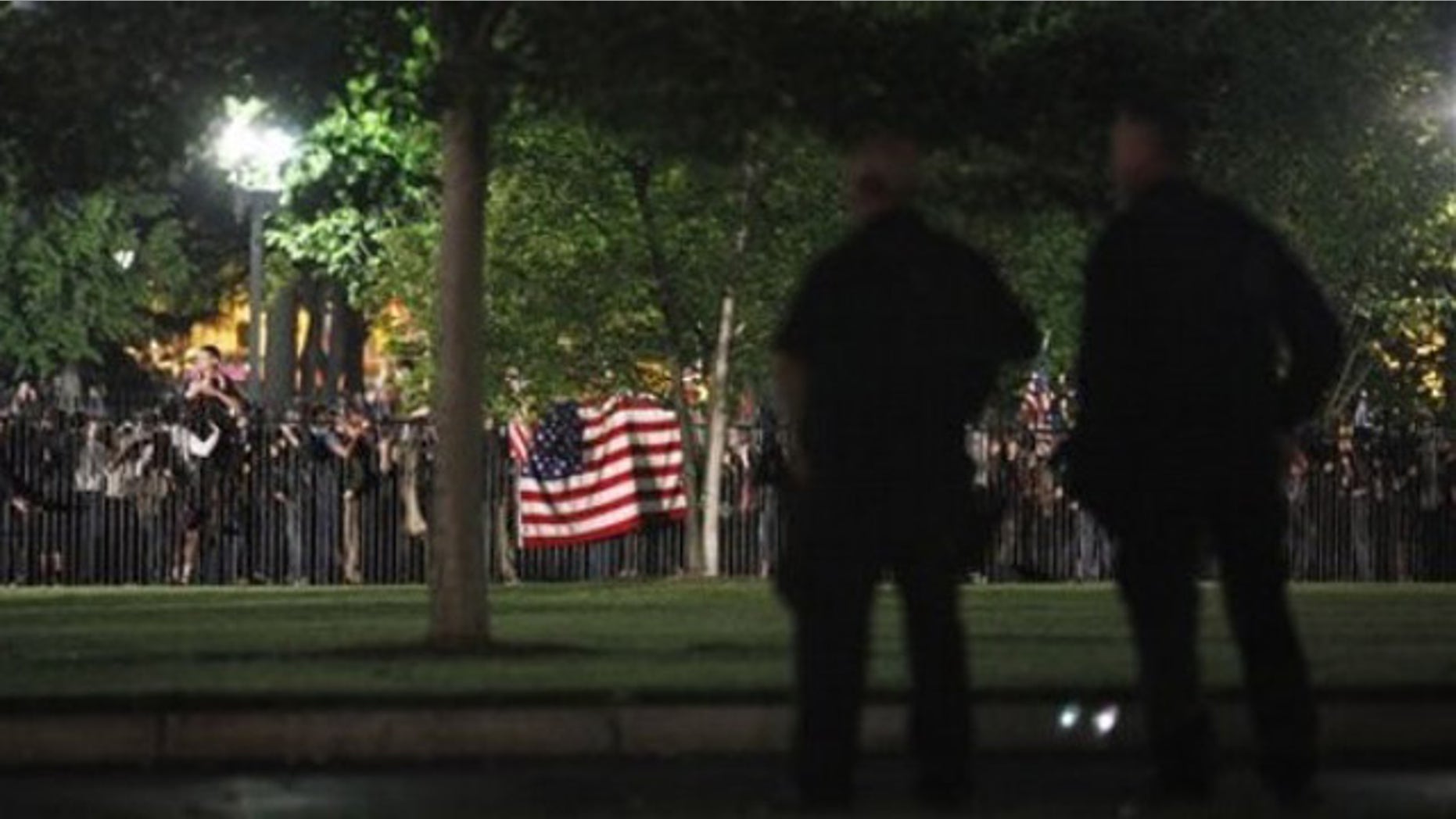 Secret Service Police watch the crowd celebrating outside the White House in Washington early Monday after President Obama announced the death of Usama bin Laden (AP).