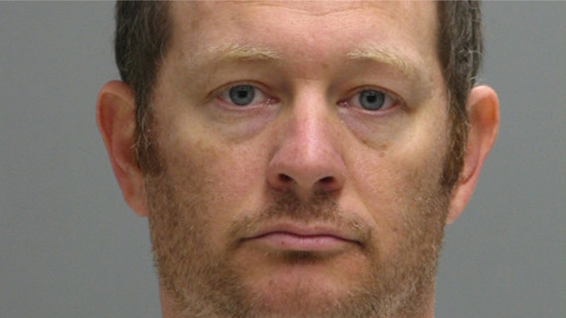 This booking photo provided by the Delaware Department of Justice shows Lee Robert Moore.