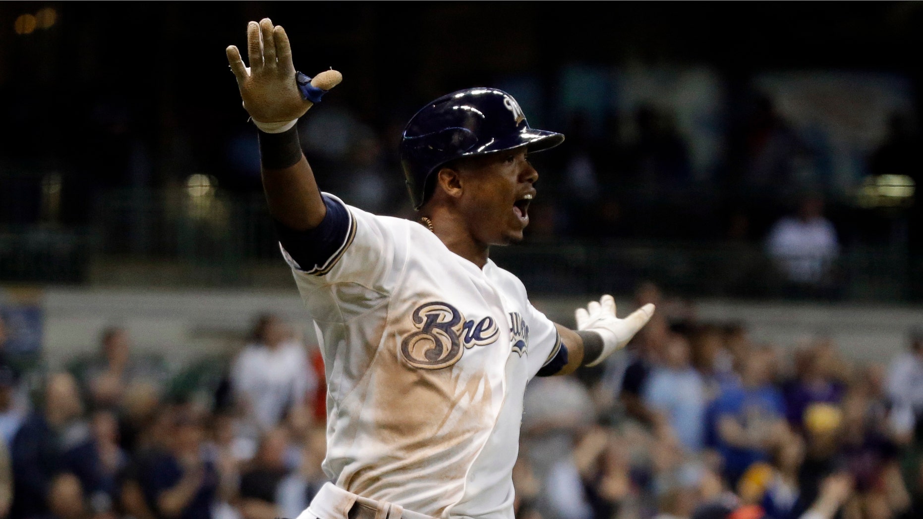 Milwaukee Brewers' Jean Segura reacts after driving in a run to tie the baseball game against the Minnesota Twins in the ninth inning Tuesday, May 28, 2013, in Milwaukee. (AP Photo/Morry Gash)