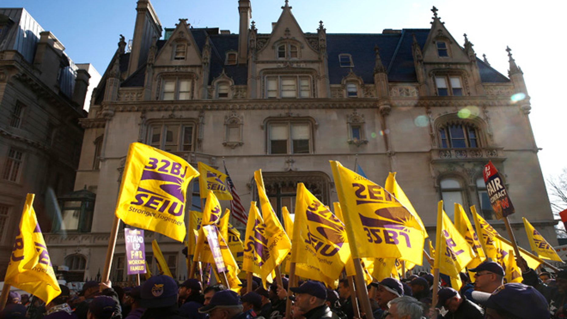 Members of the Service Employees International Union (SEIU) march during a protest in support of a new contract for apartment building workers in New York City, April 2, 2014.