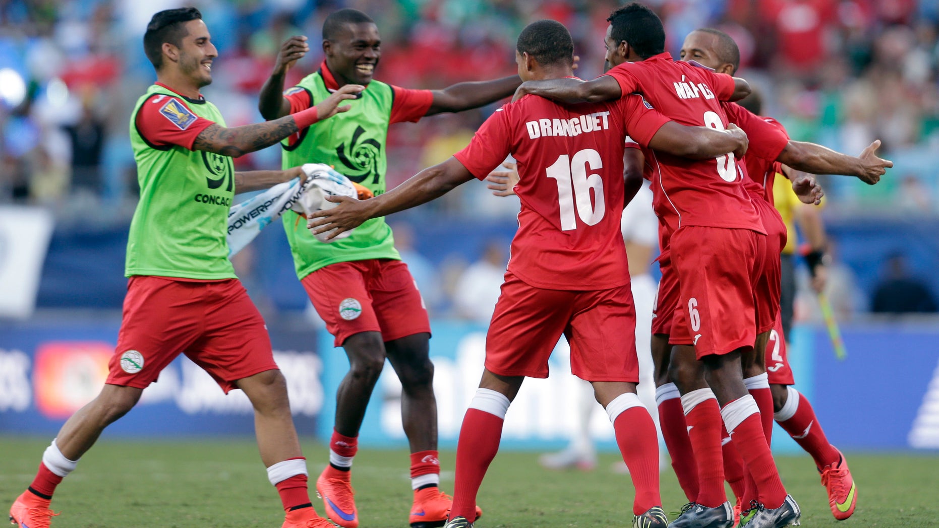Cuba players celebrate after a CONCACAF Gold Cup soccer match against Guatemala in Charlotte, N.C., July 15, 2015.