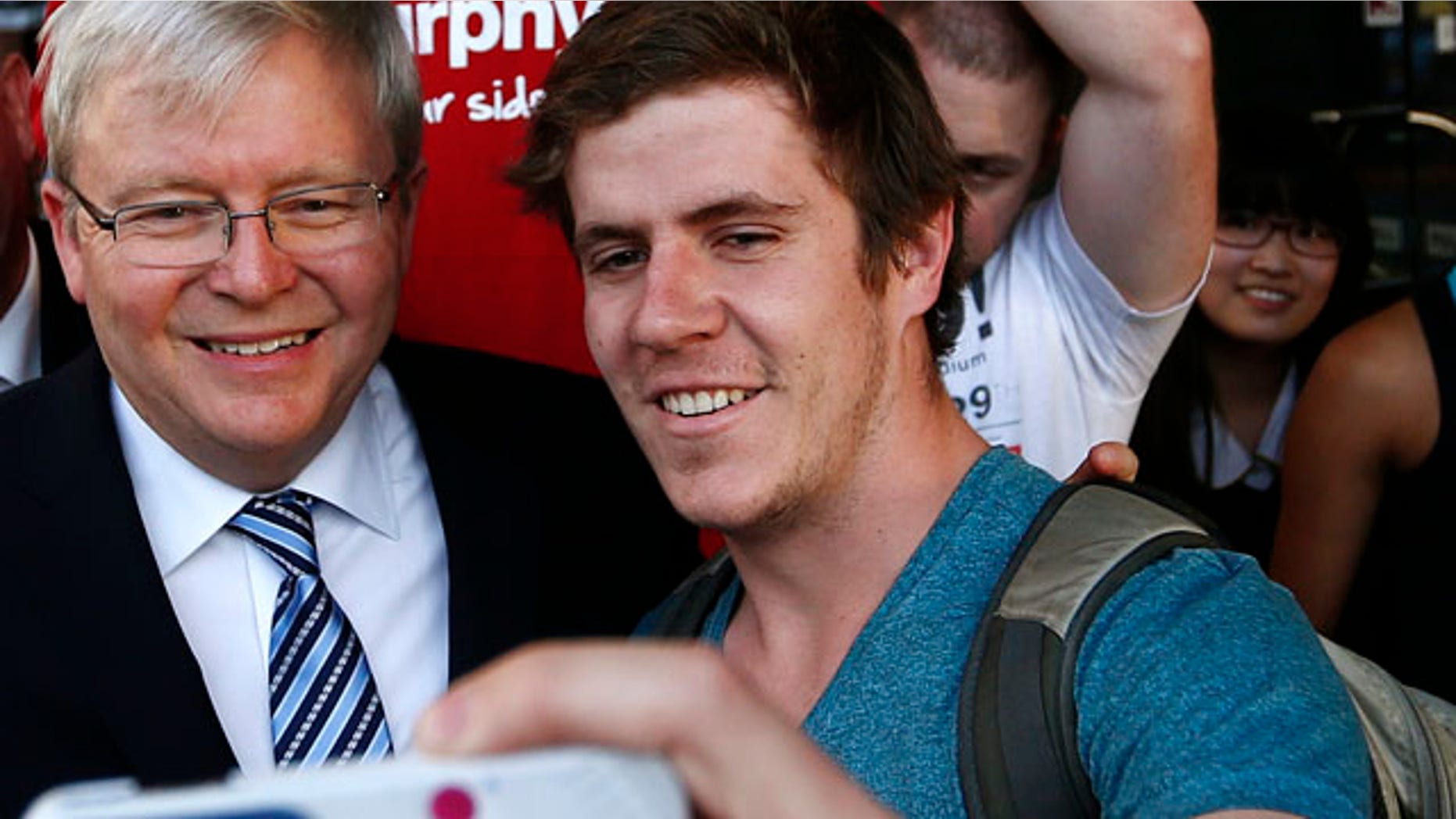 Sept. 5, 2013: Australian Prime Minister Kevin Rudd (2nd L) poses as a man takes a 'selfie' on his mobile phone.