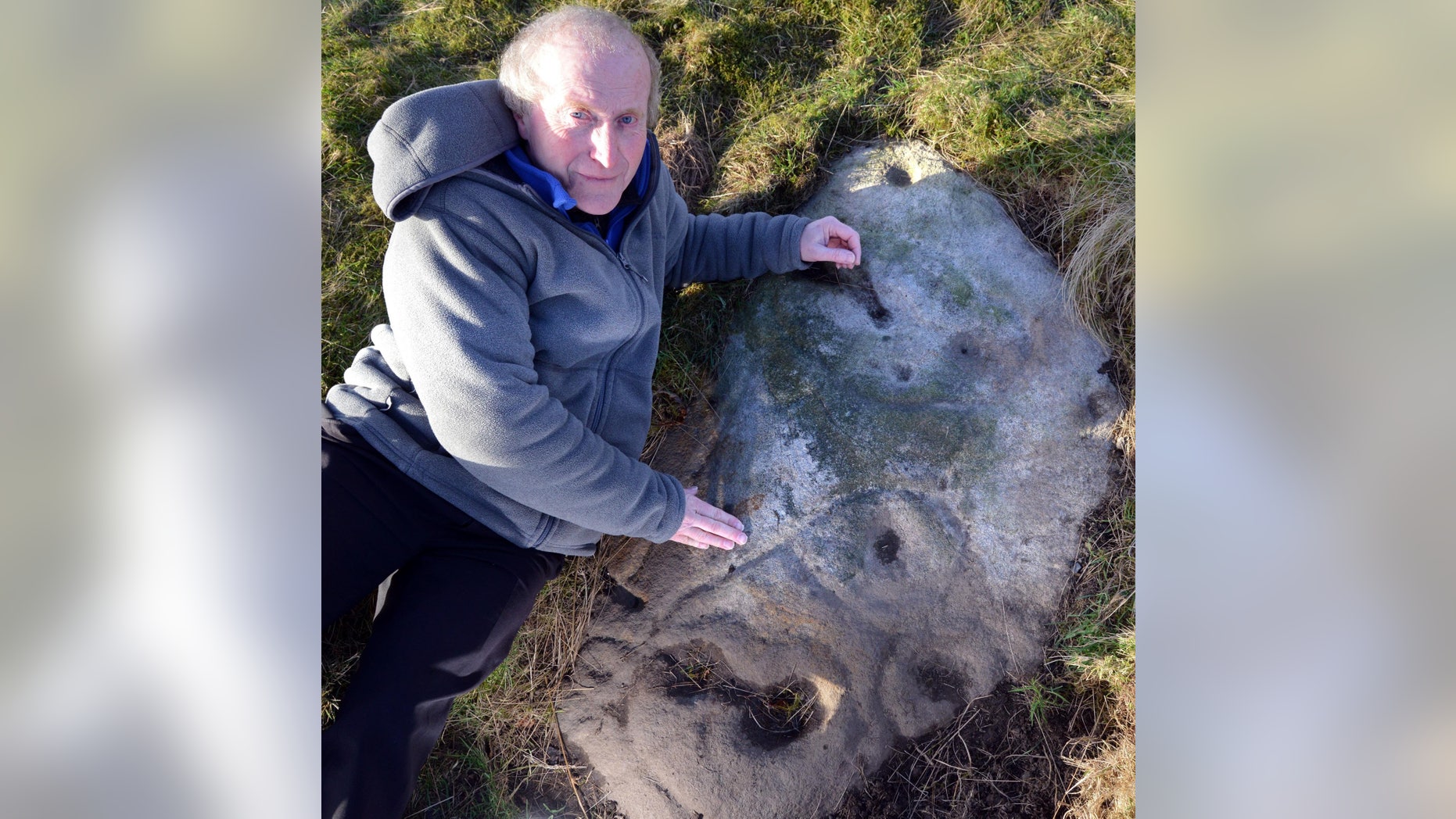 Gordon Holmes on Baildon Moor with what he believes is a Stone Age selfie of a person under the symbol for Cassiopeia.