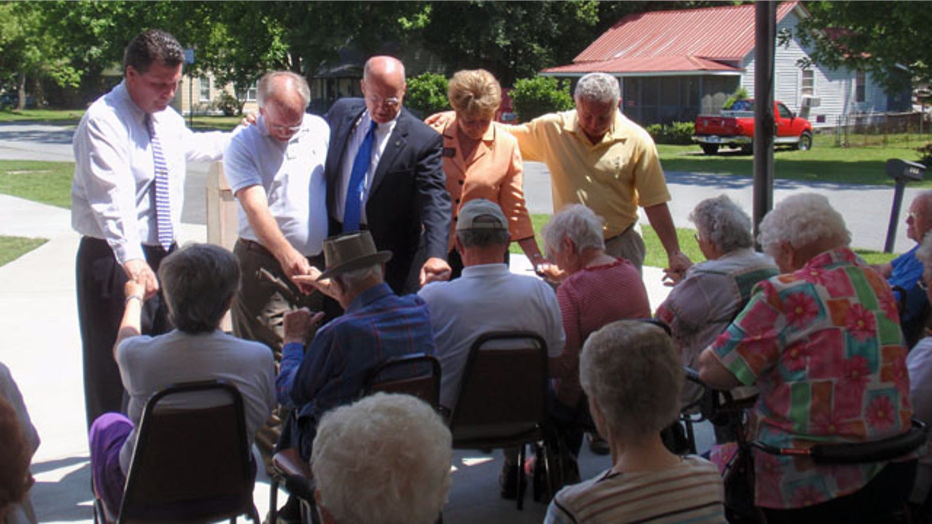 Port Wentworth Mayor Glenn "Pig" Jones, second from left, and Eric Johnson, a Republican candidate for governor, center, met with senior citizens Monday at the Ed Young Senior Citizens Center.