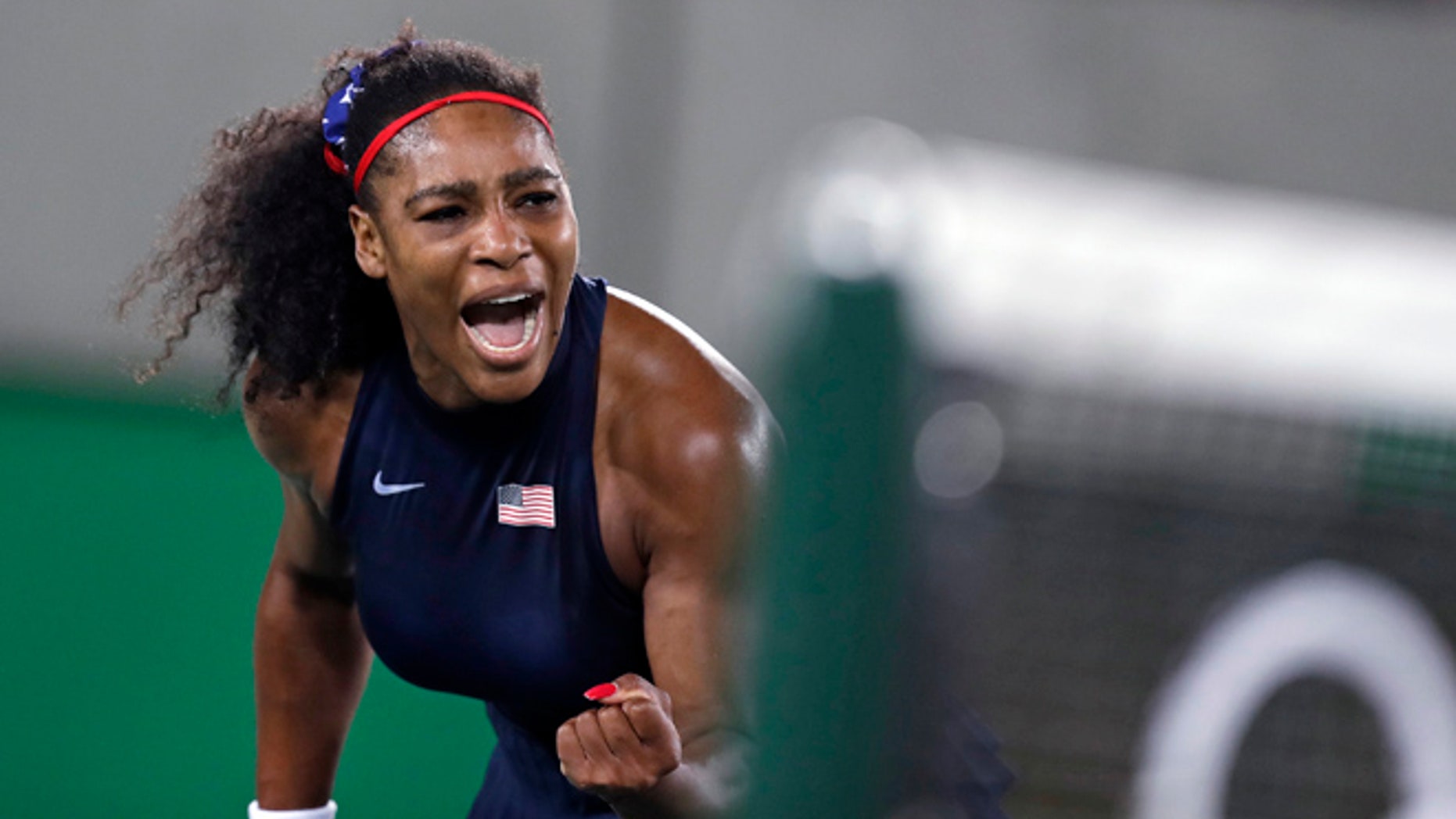 Serena Williams, of the United States, pumps her fist after winning a point at the net against Elina Svitolina, of Ukraine, at the 2016 Summer Olympics in Rio de Janeiro, Brazil, Tuesday, Aug. 9, 2016.