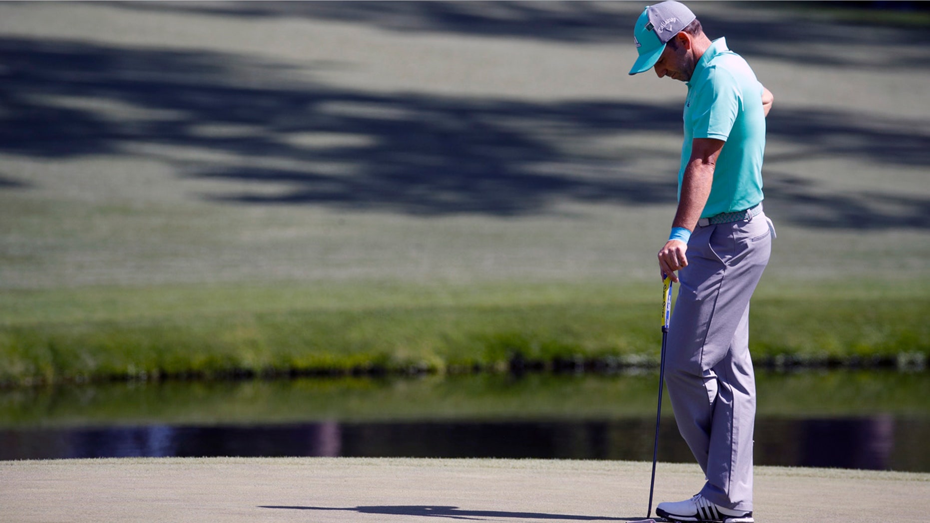 Sergio Garcia hangs his head on the 15th on his way to recording the third known 13 in Masters history.