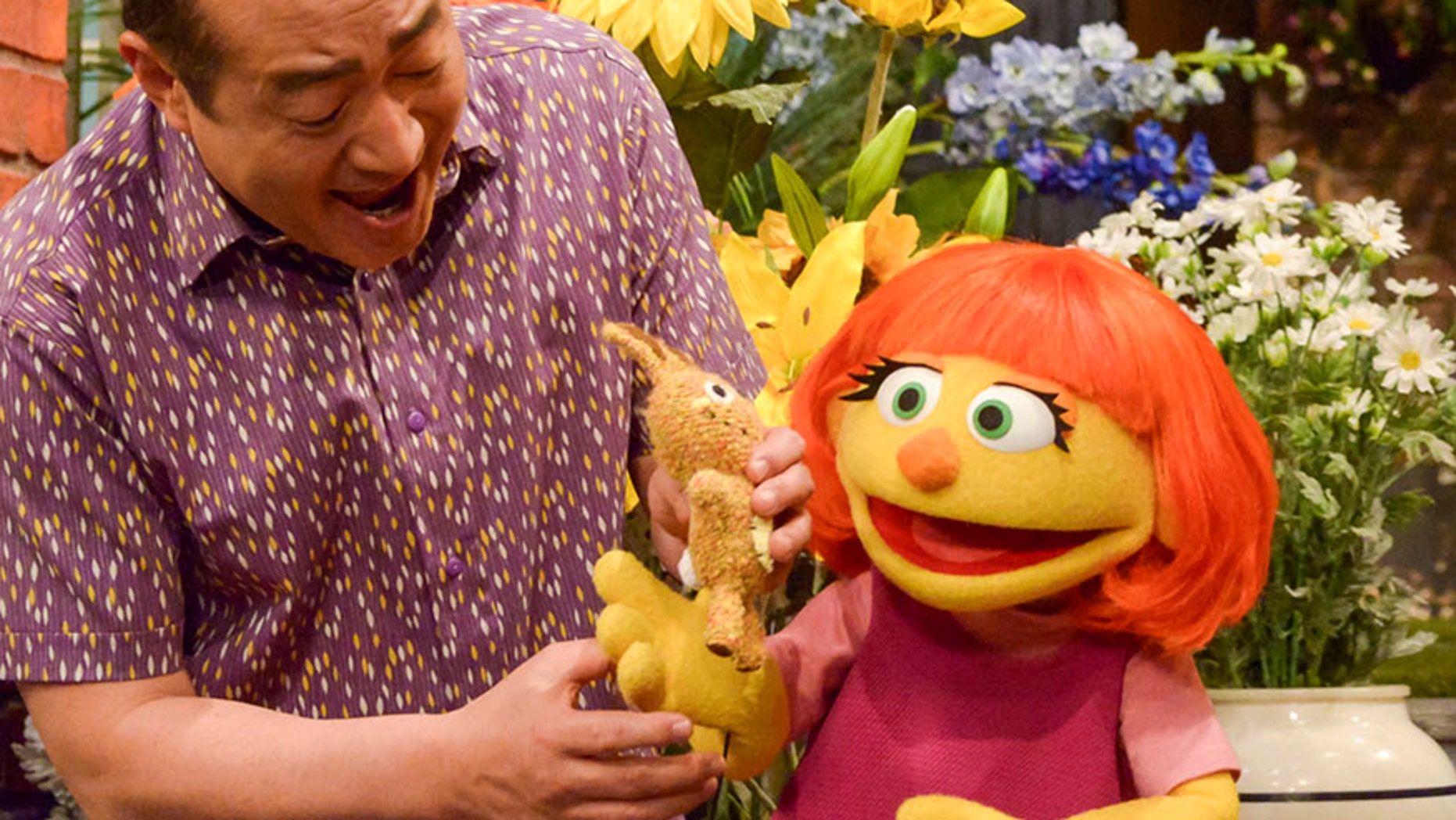 This image released by Sesame Workshop shows Julia, a new autistic muppet character debuting on the 47th Season of "Sesame Street," on April 10, 2017, on both PBS and HBO.