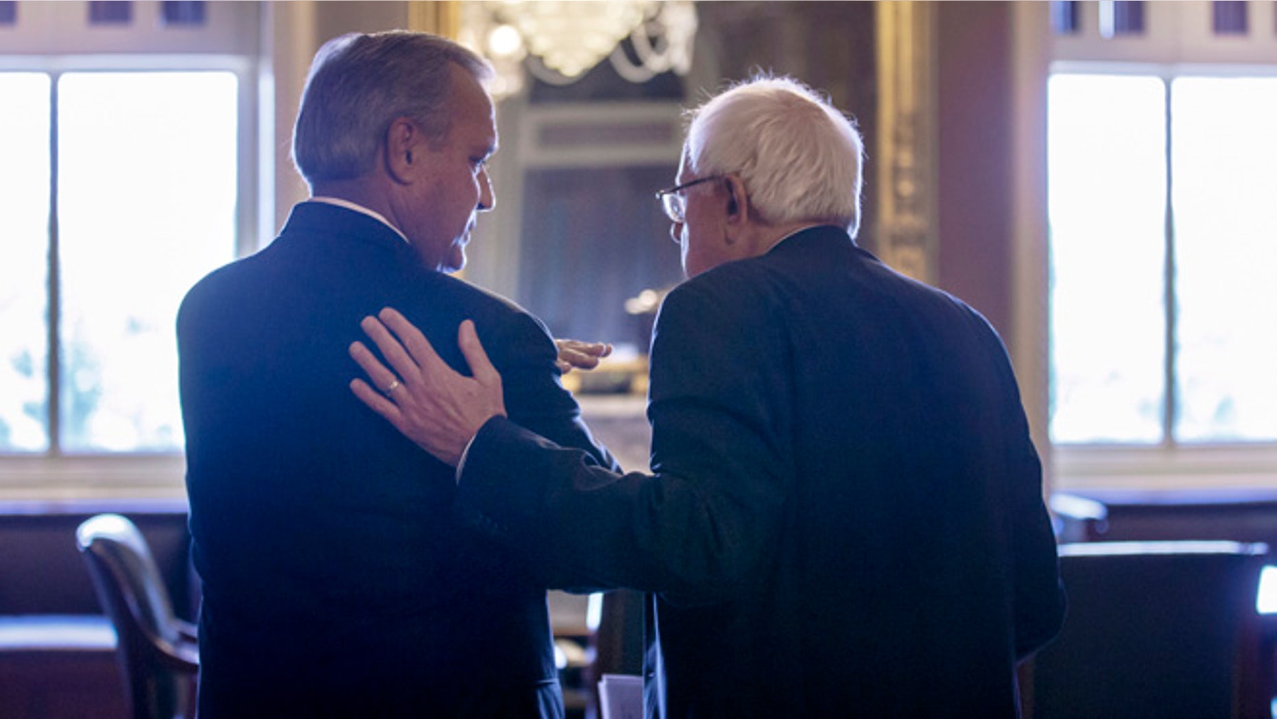 July 28, 2014: Senate Veterans Affairs Committee Chairman Sen. Bernie Sanders, I-Vt., right, and House Veterans Affairs Committee Chairman Rep. Jeff Miller, R-Fla., confer in Senate Reception before a news conference on Capitol Hill in Washington.