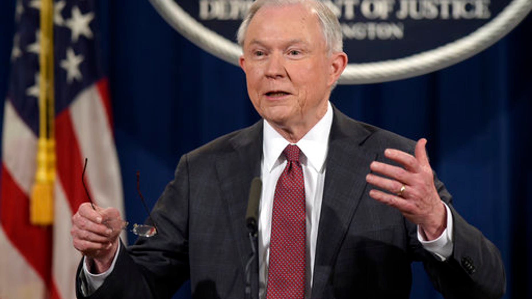 FILE - In this March 2, 2017, file photo, Attorney General Jeff Sessions speaks during a news conference at the Justice Department in Washington. City leaders across the U.S. are vowing to intensify their fight against President Donald Trump's promised crackdown on so-called "sanctuary cities" despite the financial risks. Defiance that filled a New York City gathering of municipal officials from urban centers clashed Monday, March 27, with pointed warnings from the White House's West Wing, where Sessions issued a dire warning to urban leaders. (AP Photo/Susan Walsh, File)