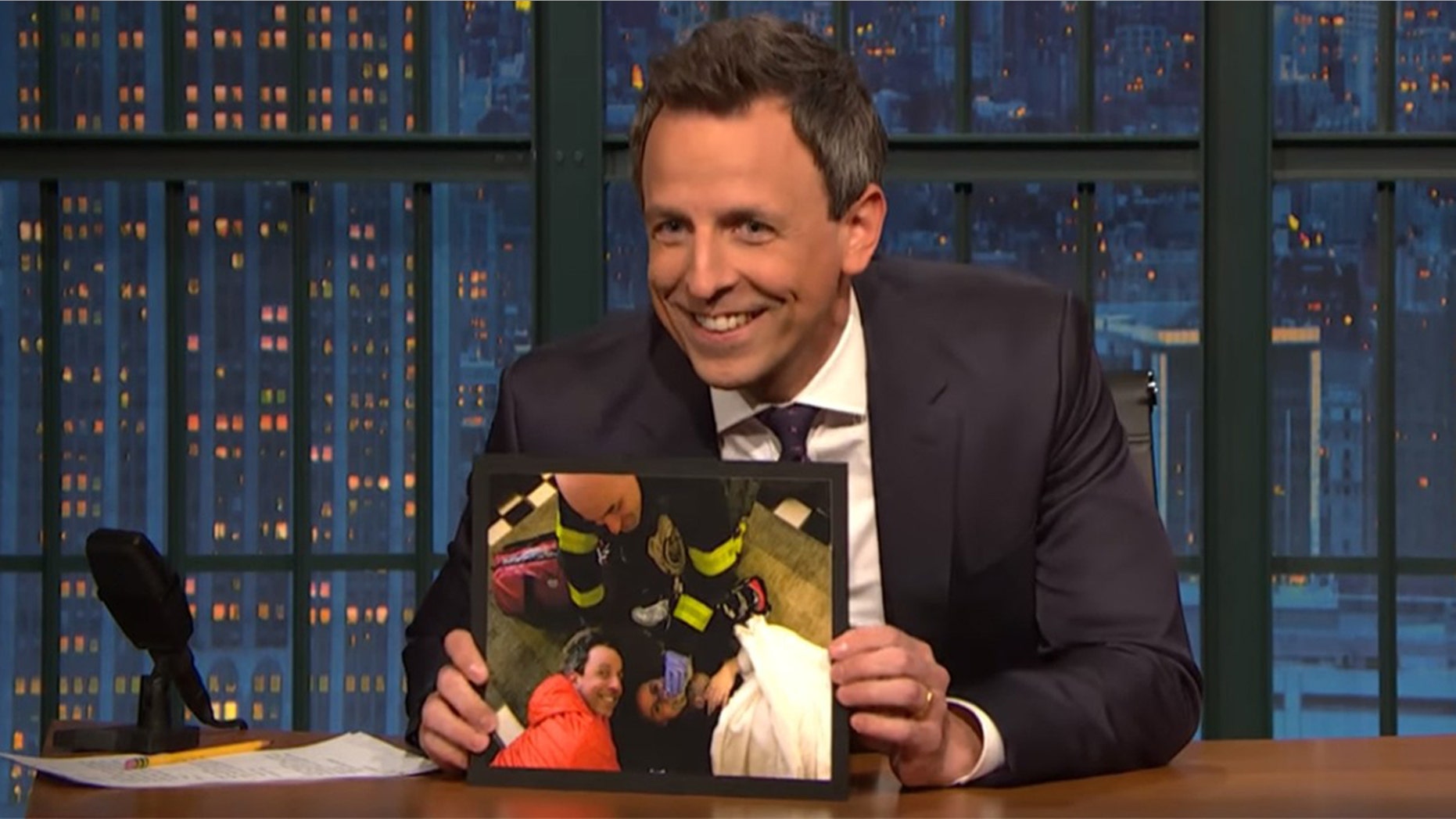 Seth Meyers shows off photos of wife giving birth to their second son in their hotel lobby on Monday's night "Late Night with Seth Meyers."