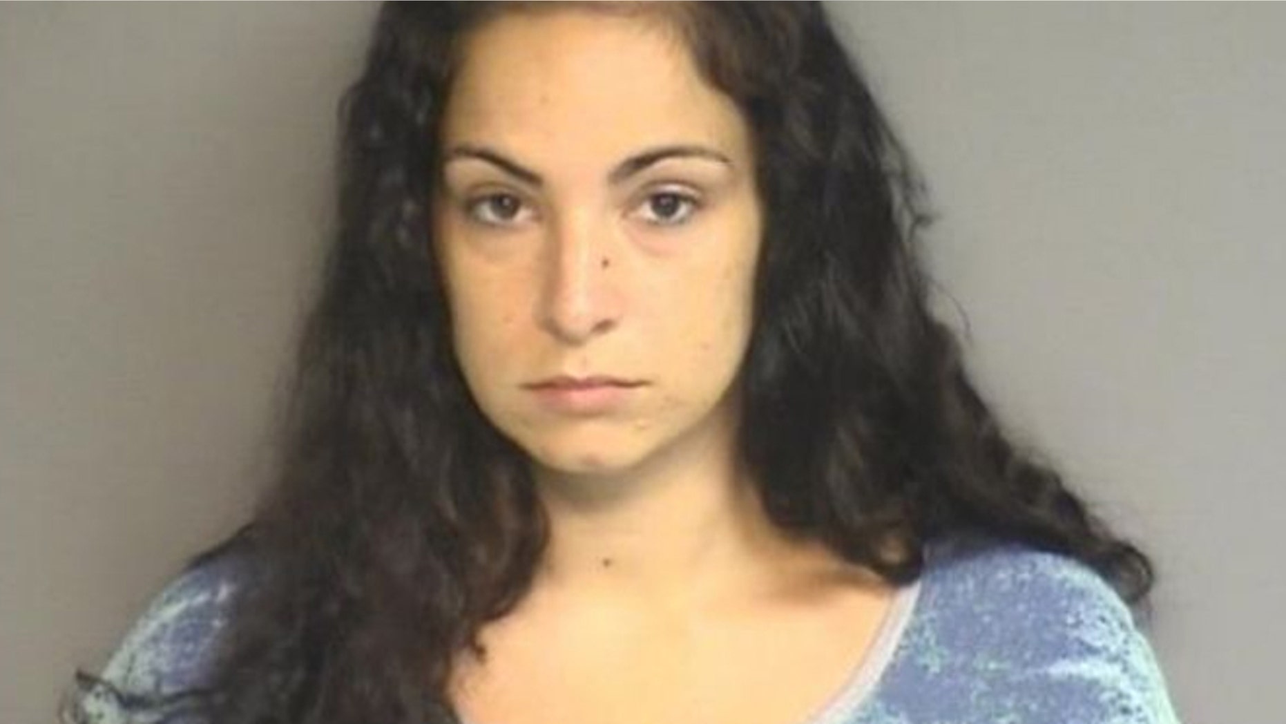Danielle Watkins of Norwalk turned herself in to police Thursday. She is charged with sexual assault, sale of marijuana and risk of injury to a minor.