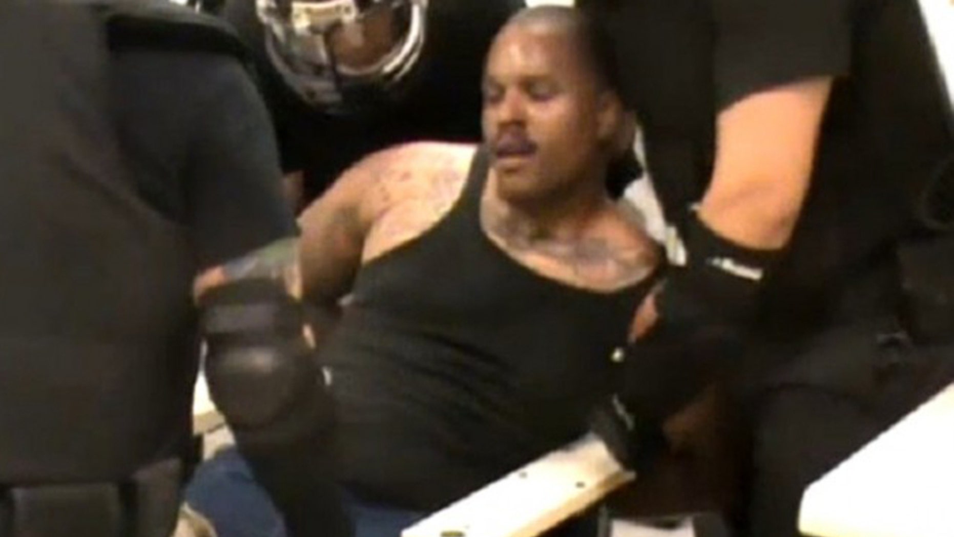 Brown was in distress in his final moments in an El Paso jail, before guards rushed in in riot gear. (Screengrab)