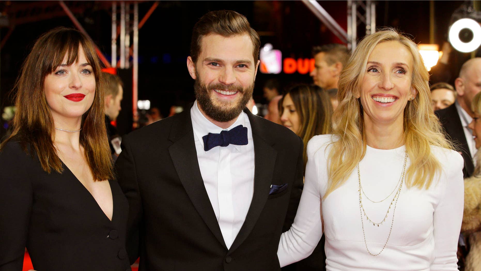 Feb. 11, 2015: Actress Dakota Johnson, actor Jamie Dornan and director Sam Taylor-Johnson, from left, pose for photographers on the red carpet for the world premiere of Fifty Shades of Grey at the 2015 Berlinale Film Festival in Berlin.