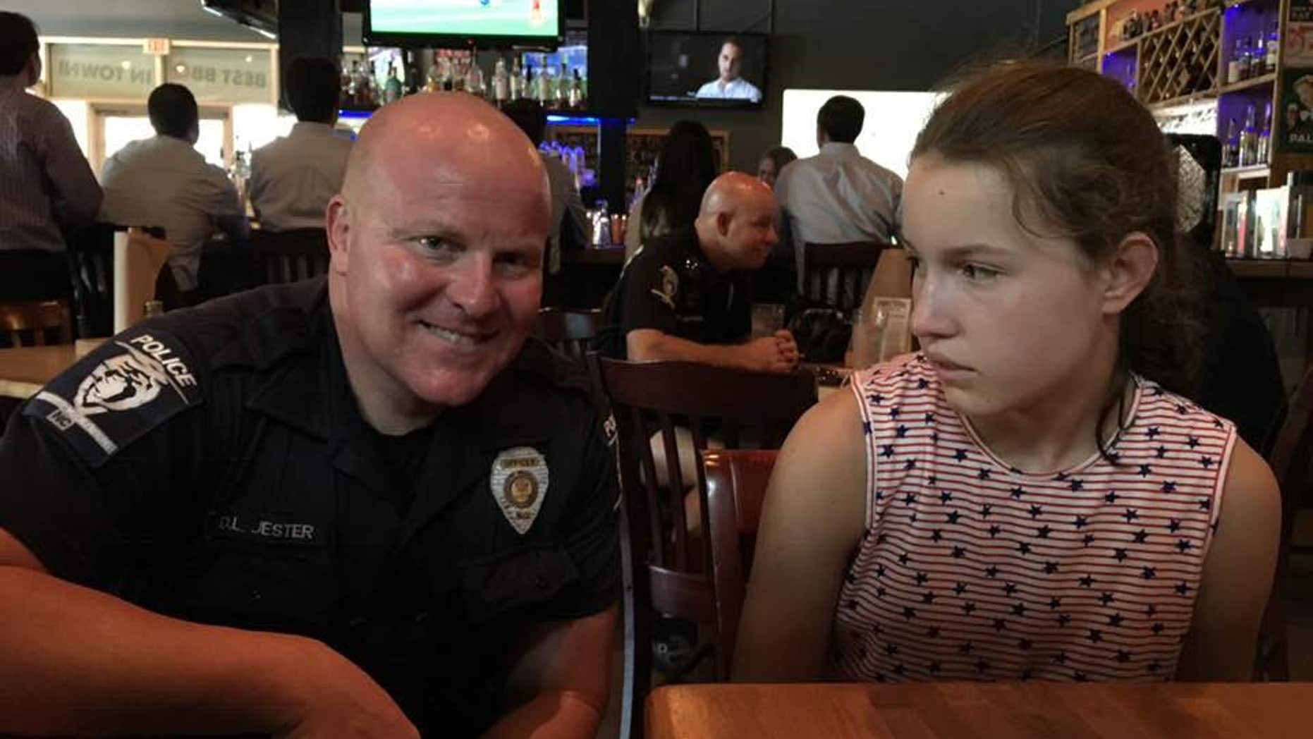 Cindy Frederick is grateful for a Charlotte-Mecklenburg Police officer who took time away from his meal to sit with her family and take a picture with her daughter in an effort to teach her that law enforcement can help her if ever needed.