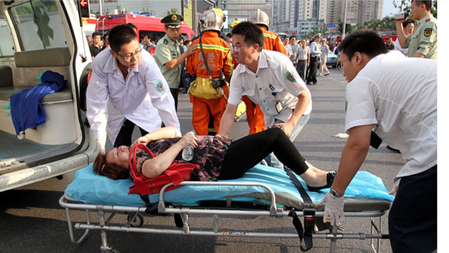 Sept. 27: Rescuers carry the injured after two subway trains collided in Shanghai, east China.