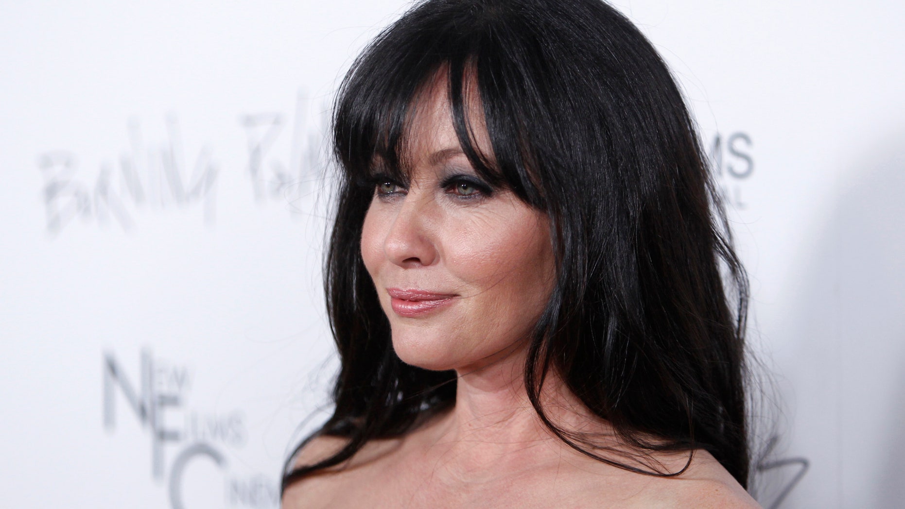 January 12, 2011. Shannen Doherty poses at the premiere of the film "Burning Palms" at the Arclight theatre in Hollywood, California.