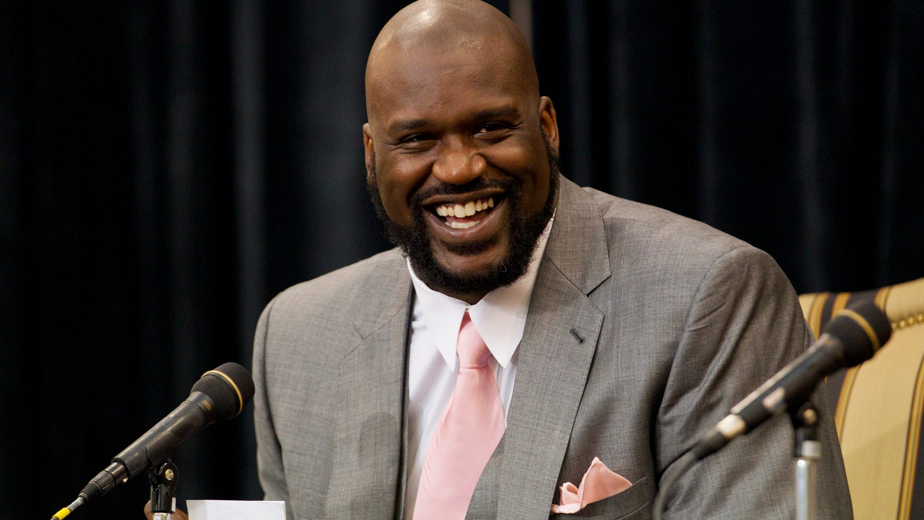 June 3, 2011. Shaquille O'Neal laughs while telling a story during his announcement of his retirement from the National Basketball Association (NBA) at a news conference at his home in Windermere, Florida.