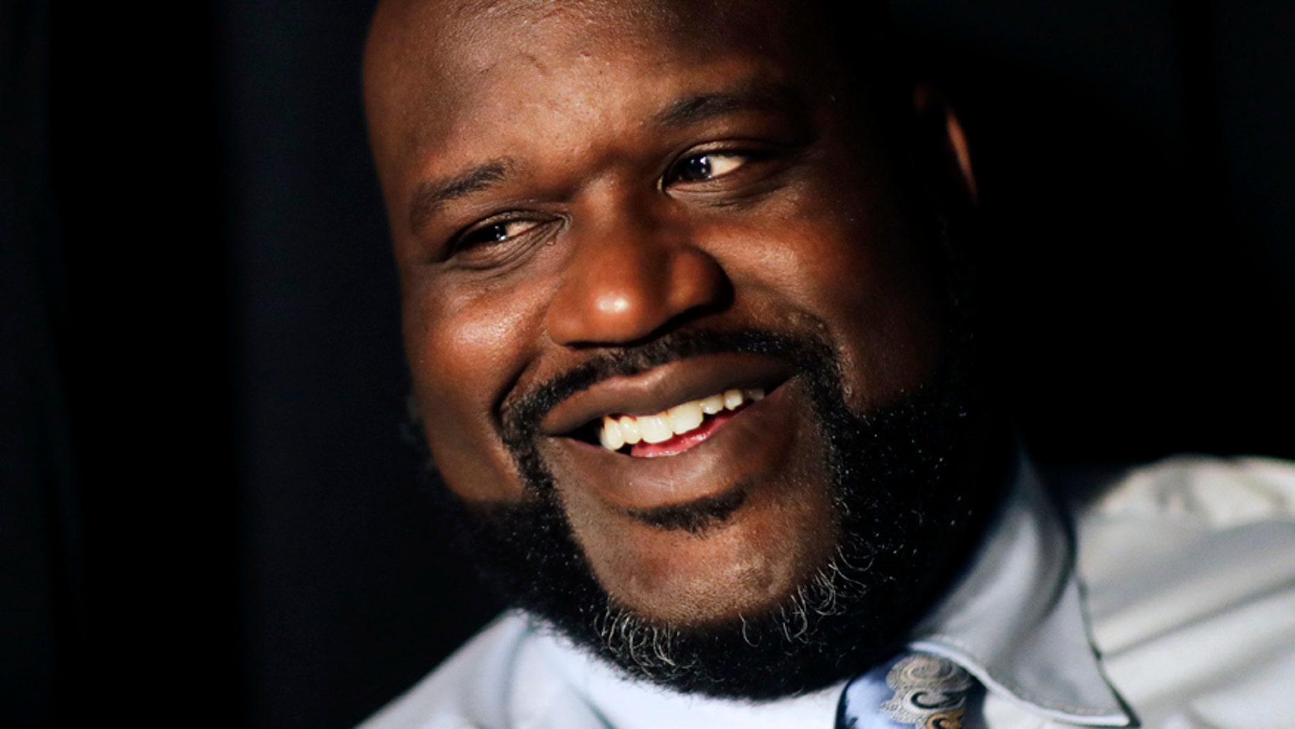 Former NBA basketball player Shaquille O'Neal sits off-set on a break from taping a commercial in Atlanta, Tuesday, April 18, 2017.