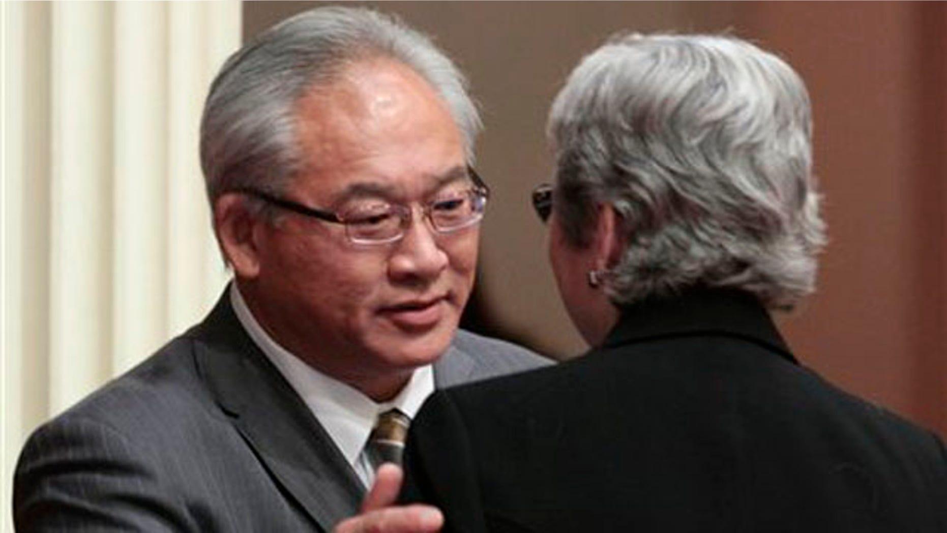 Assemblyman Paul Fong, D-Cupertino, thanks Sen. Christine Kehoe, D-San Diego, for help after his measure banning the sale, trade or possession of shark fins was approved by the Senate in Sacramento, Calif., Tuesday, Sept. 6, 2011.