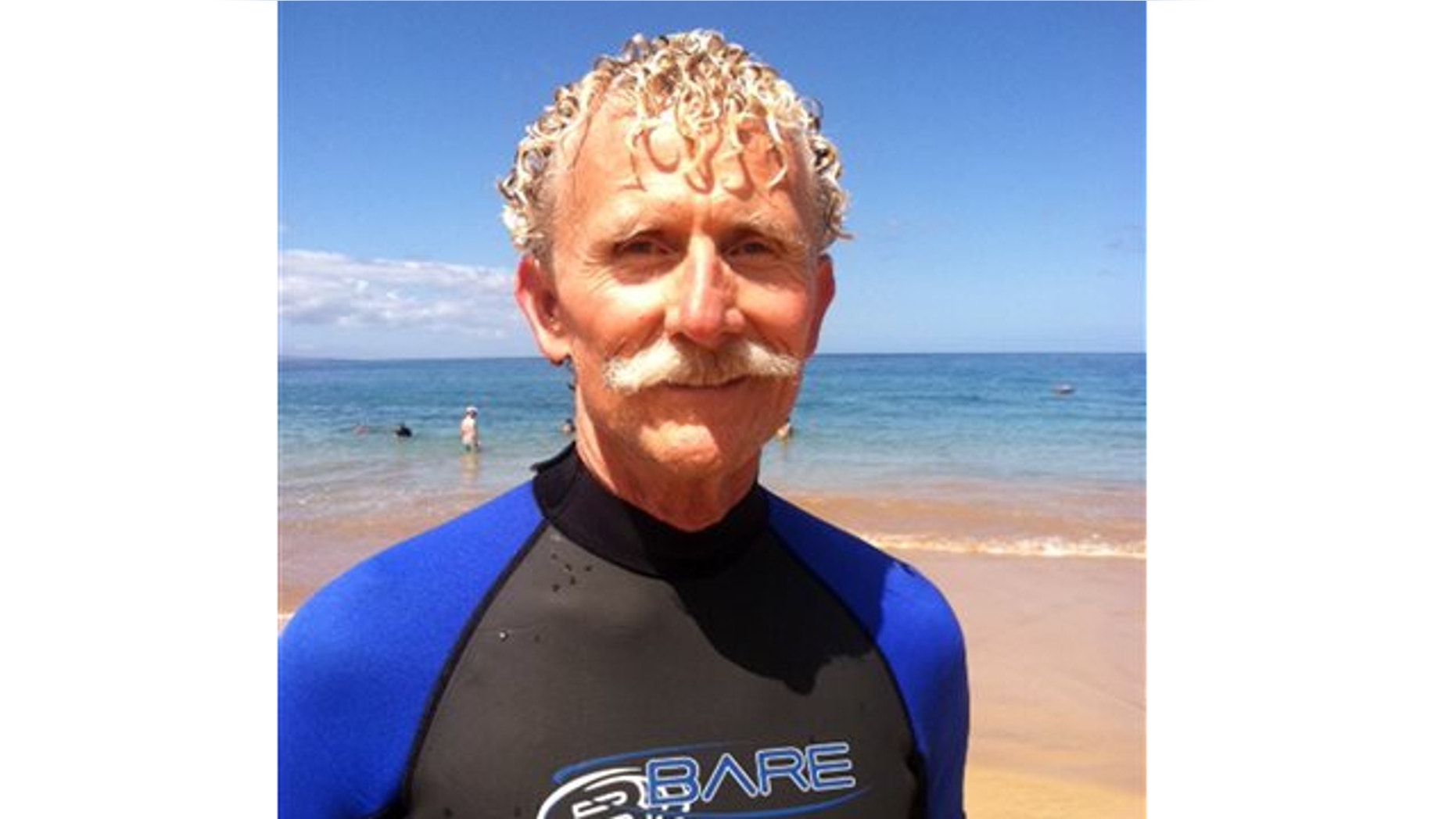 Aug. 15, 2013: Rick Moore poses at Palauea Beach in Makena on the island of Maui, Hawaii, a day after he jumped into the water to rescue a shark attack victim who lost her arm.