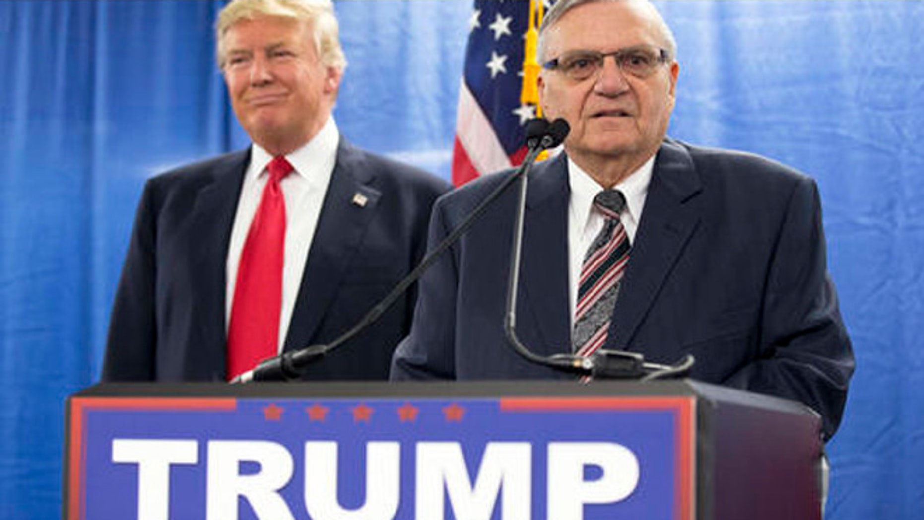 FILE - In this Jan. 26, 2016 file photo, Republican presidential candidate Donald Trump, left, is joined by Maricopa County, Ariz., Sheriff Joe Arpaio during a new conference in Marshalltown, Iowa. Arizona's presidential primary marked a return to the political spotlight for Arpaio, an influential figure in Republican circles on immigration enforcement who has spent the last year lying low as he faces the possibility of criminal charges. His endorsement of Republican front-runner Donald Trump led to a round of TV interviews and appearances with the candidate, including a rally in Arpaio's hometown.(AP Photo/Mary Altaffer, File)