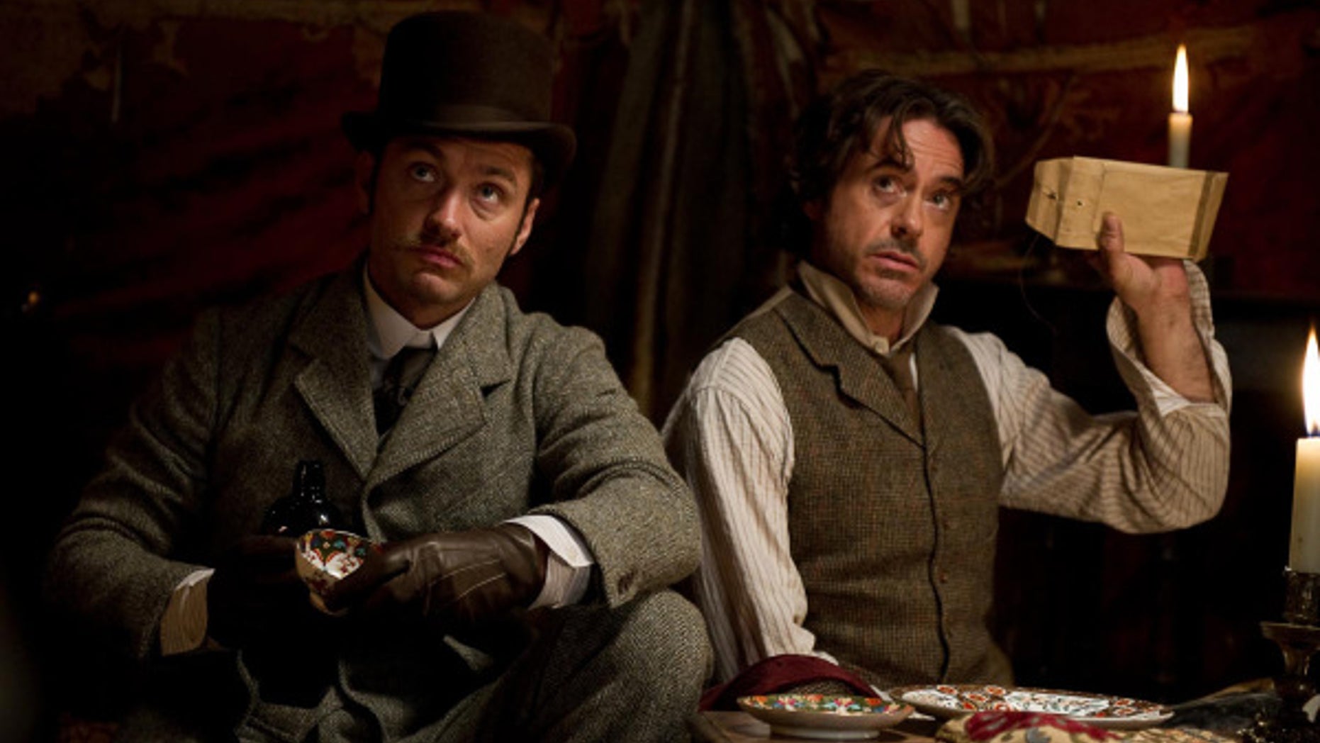 Robert Downey, Jr., right, and Jude Law star as Sherlock Holmes and Dr. Watson in “Sherlock Holmes: A Game of Shadows.” (Warner Bros. 2011)