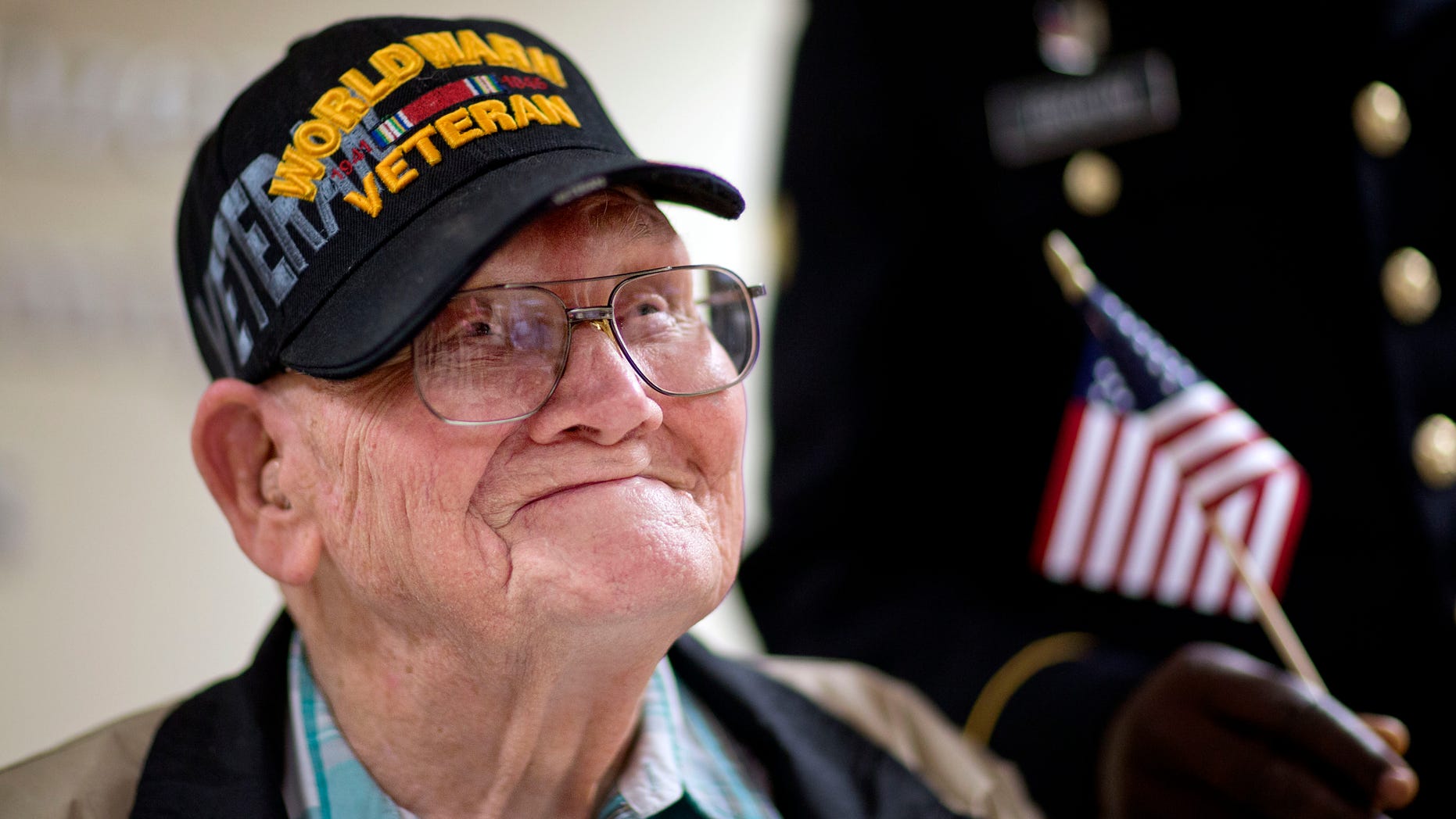 June 2, 2014: Ninety-four-year-old World War II veteran Sherwin Callander talks to the media after a naturalization ceremony.