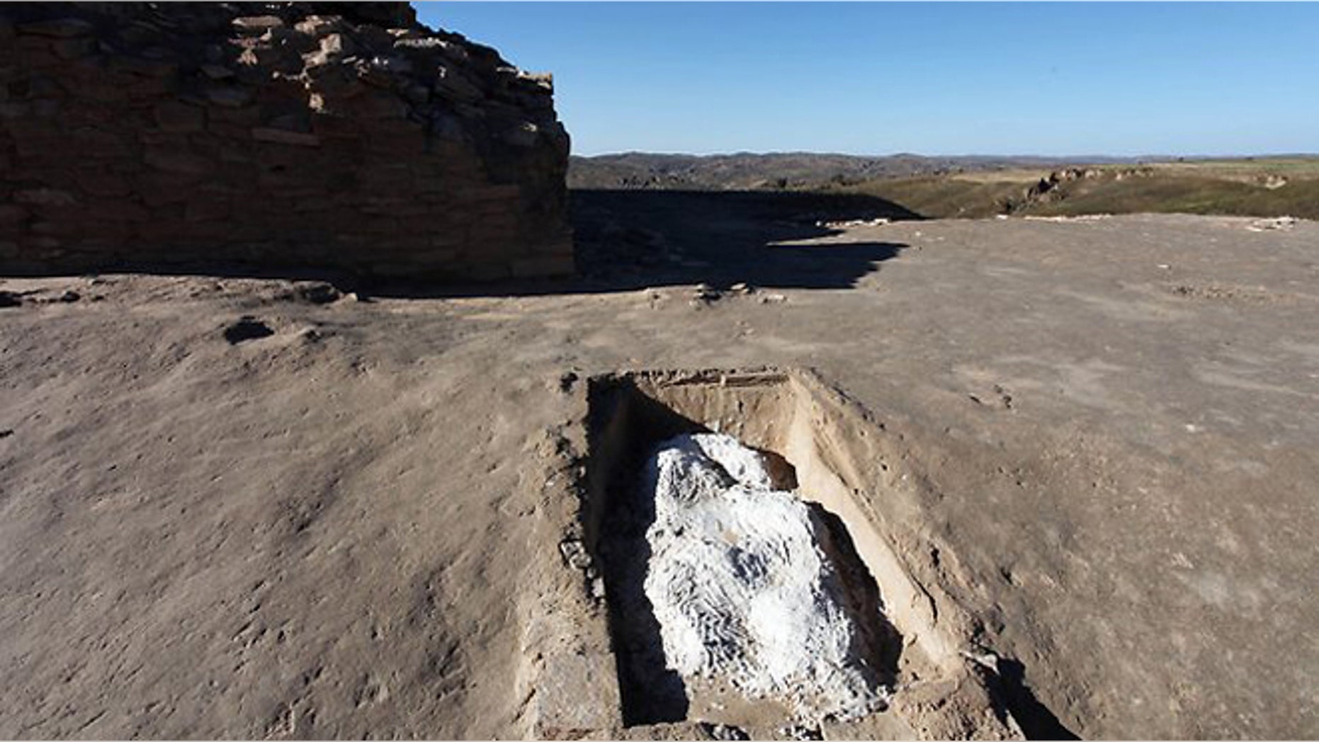 A grave covered by plaster after it was found in what archaeologists believe to have been a mass grave at the Shimao Ruins, the site of a neolithic stone city in Shenmu county, northern China's Shaanxi province.