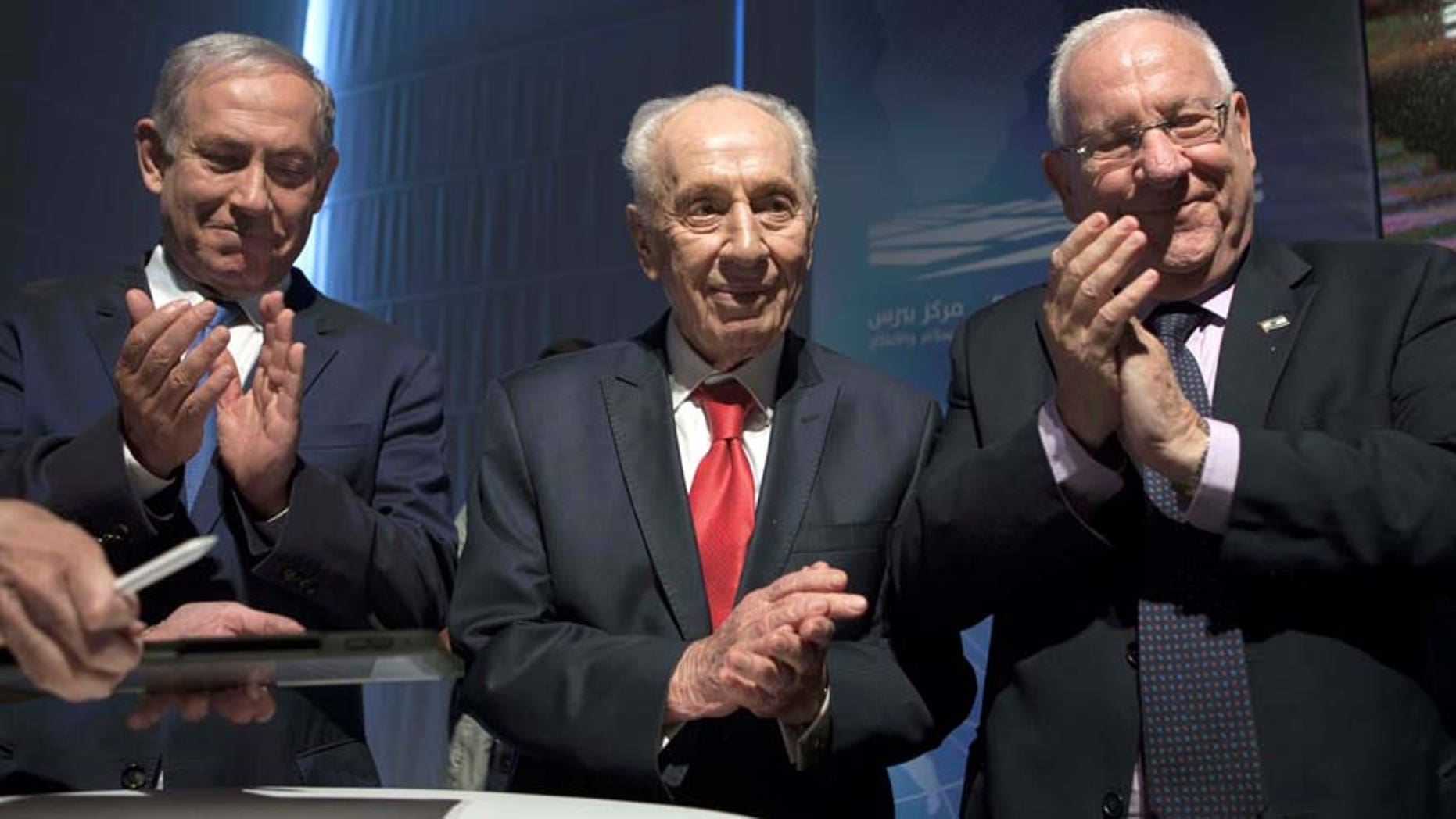 July 21, 2016: Israeli Prime Minister Benjamin Netanyahu, left, former Israeli President Shimon Peres, center, and Israel's President Reuven Rivlin are seen during a ceremony at the Peres Center for Peace in Jaffa, Israel.