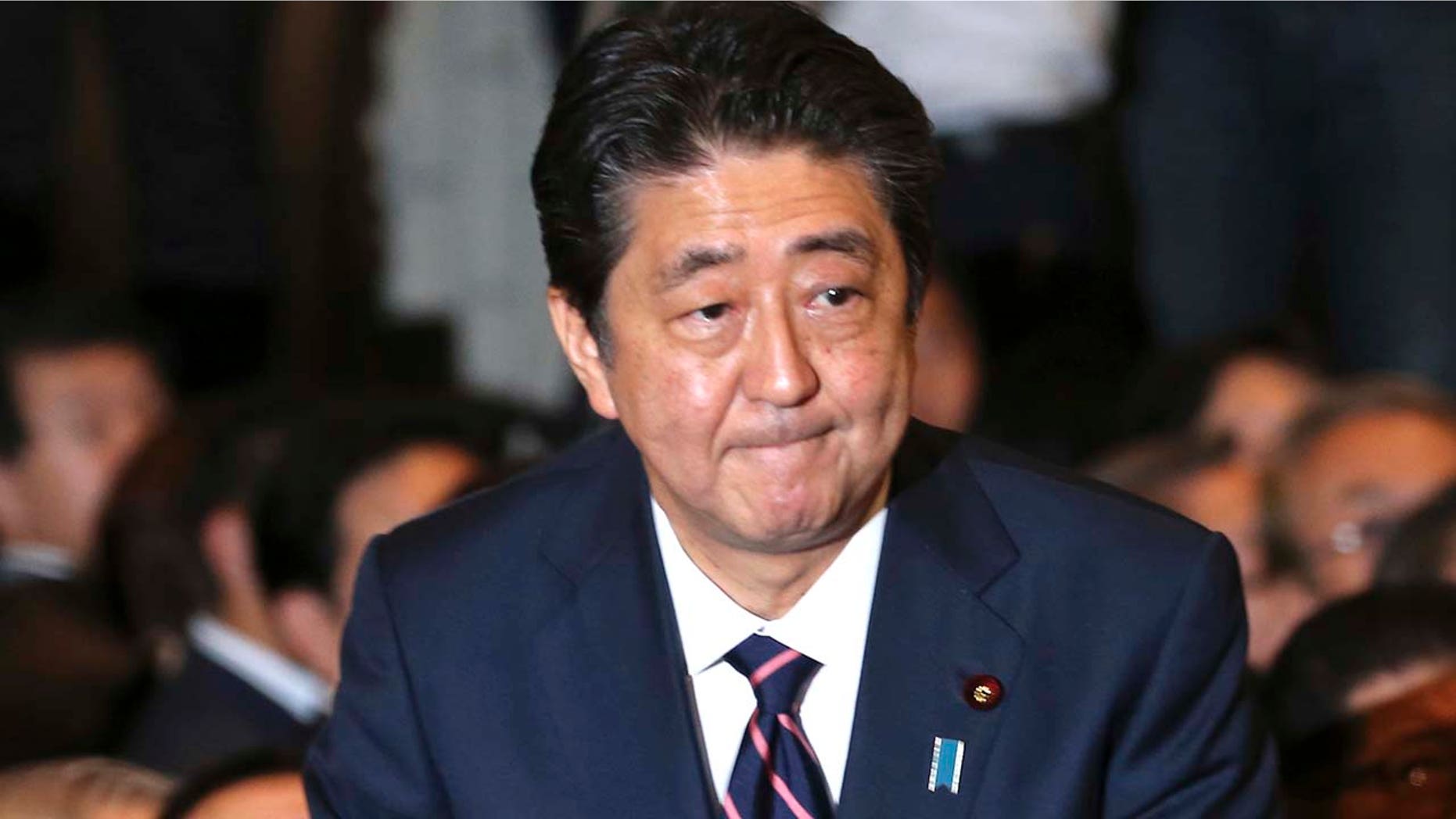 Liberal Democratic Party President Shinzo Abe receives applause from the LDP lawmakers shortly after his name was called as the winner of the ruling party presidential elections at its headquarters in Tokyo, Sept. 20, 2018.