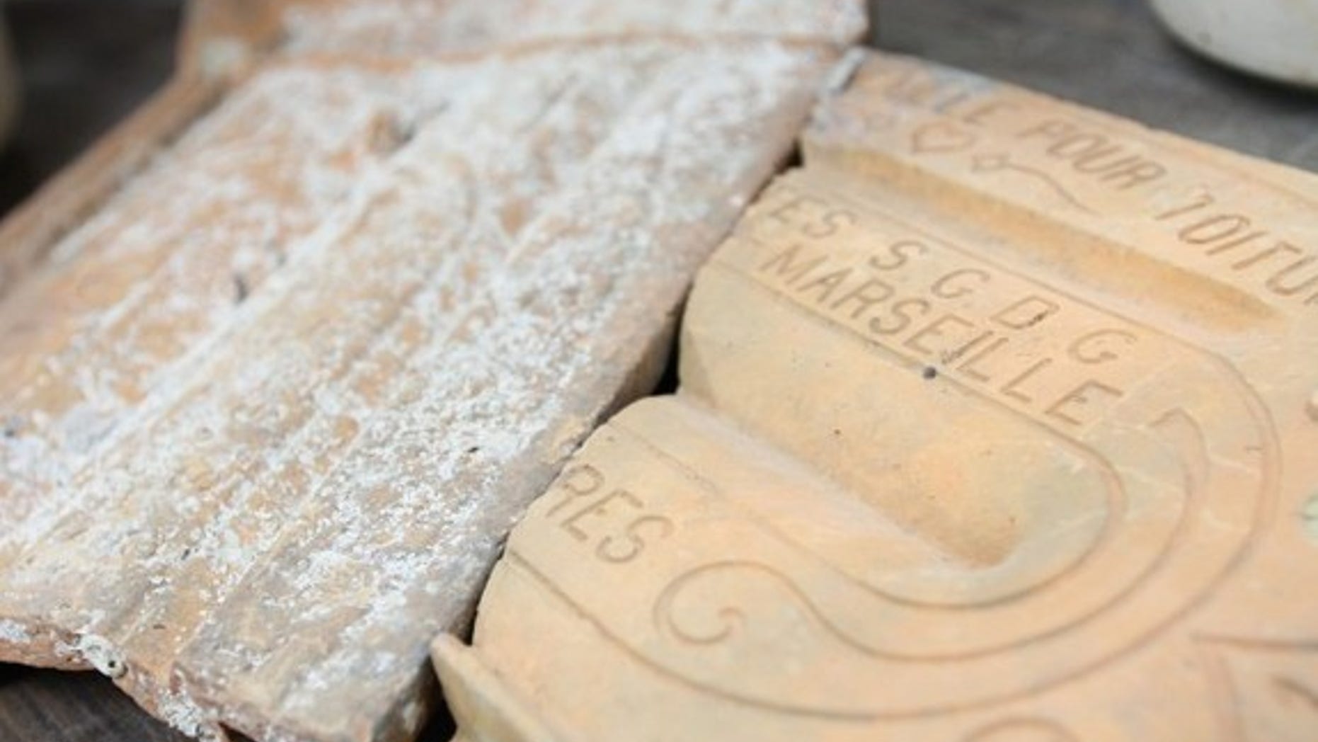 A sunken ship that was uncovered in a lagoon off the coast of Israel may have once belonged to a famous banking baron. Items recovered from the ship, shown here, suggest it was navigating the seas in the late 1800s.