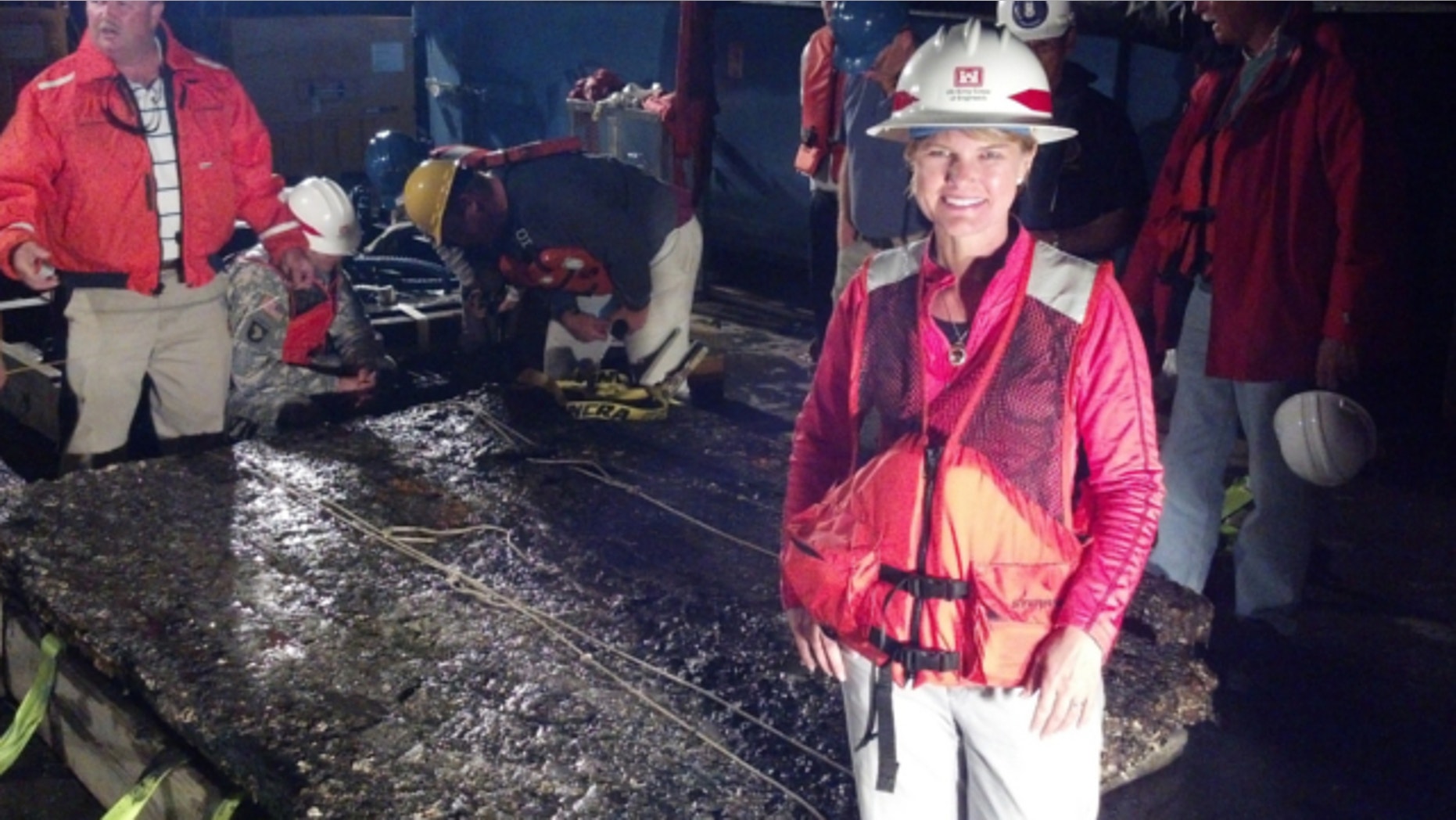 Nov. 12, 2013: Julie Morgan, a staff archeologist with the U.S. Army Corps of Engineers Savannah District, stands next to a 5,000-pound piece of the CSS Georgia, a Civil War ironclad scuttled in the Savannah River in 1864.