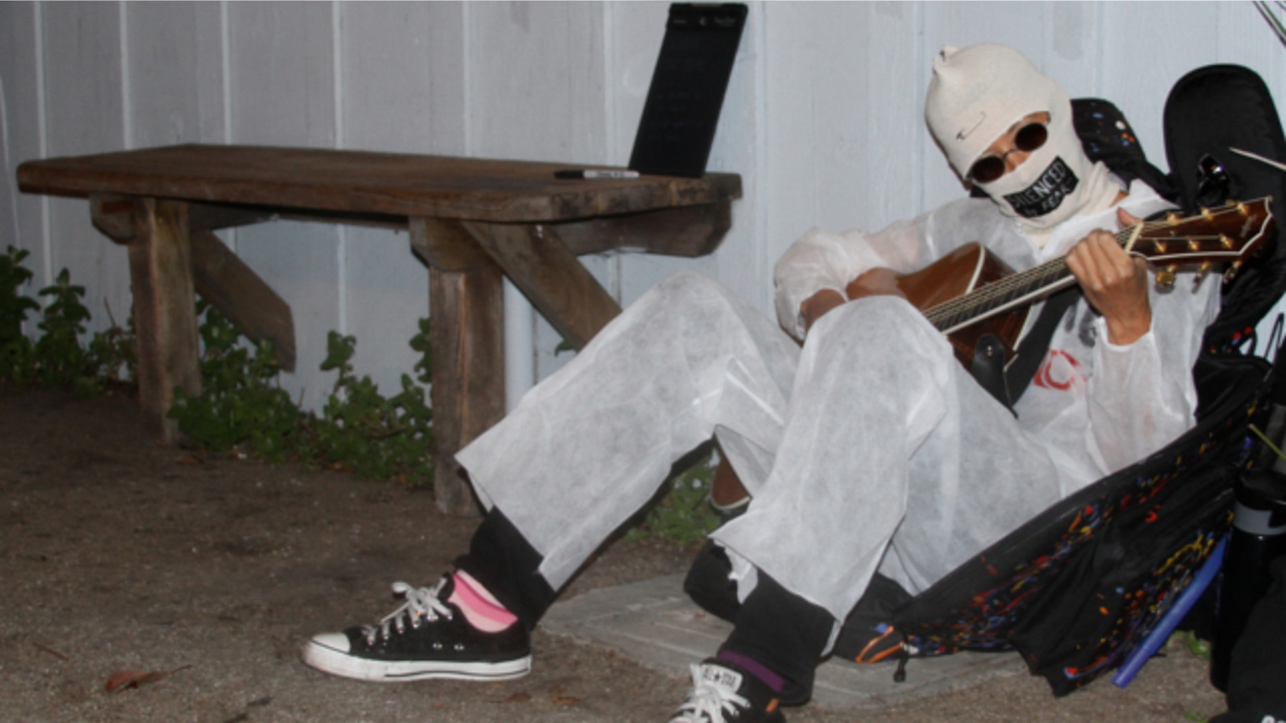 March 28, 2013: Alternative folk singer Michelle Shocked sits outside Moe’s Alley nightclub in Santa Cruz Calif., and strums her guitar.