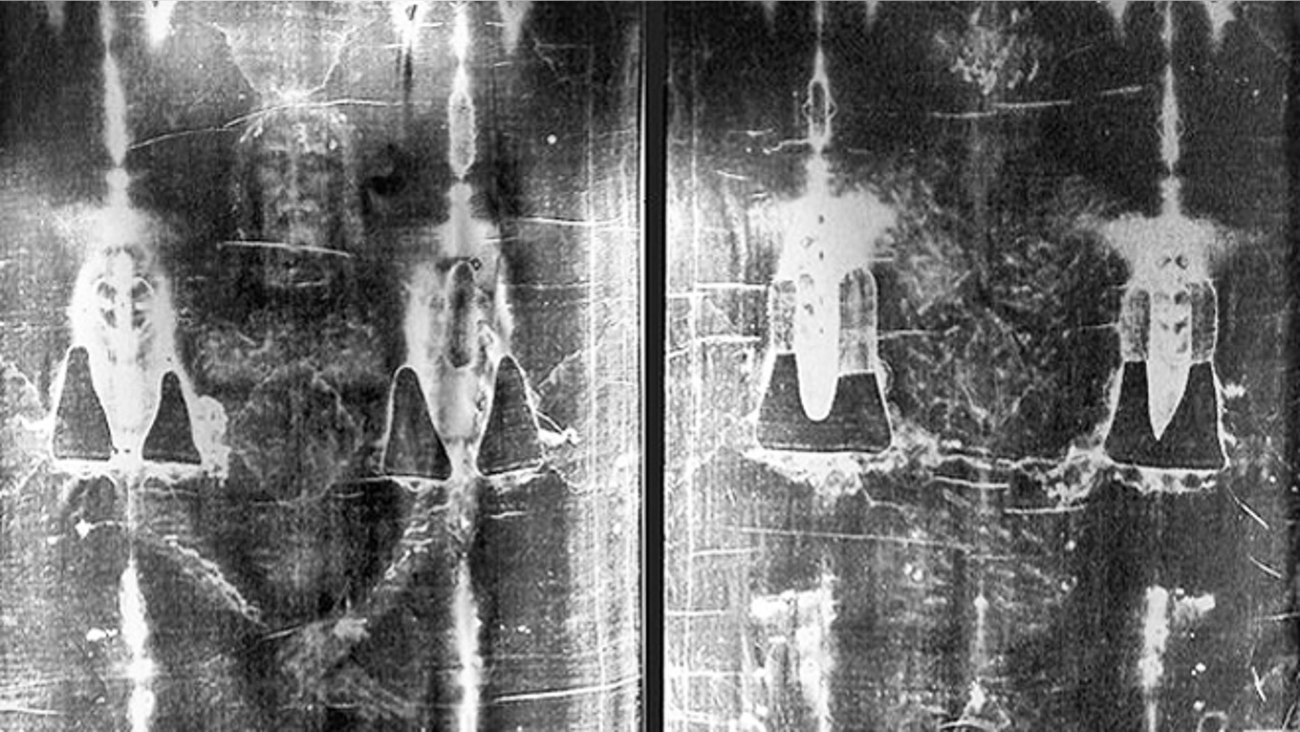 Full-length negative photograph of the Shroud of Turin.