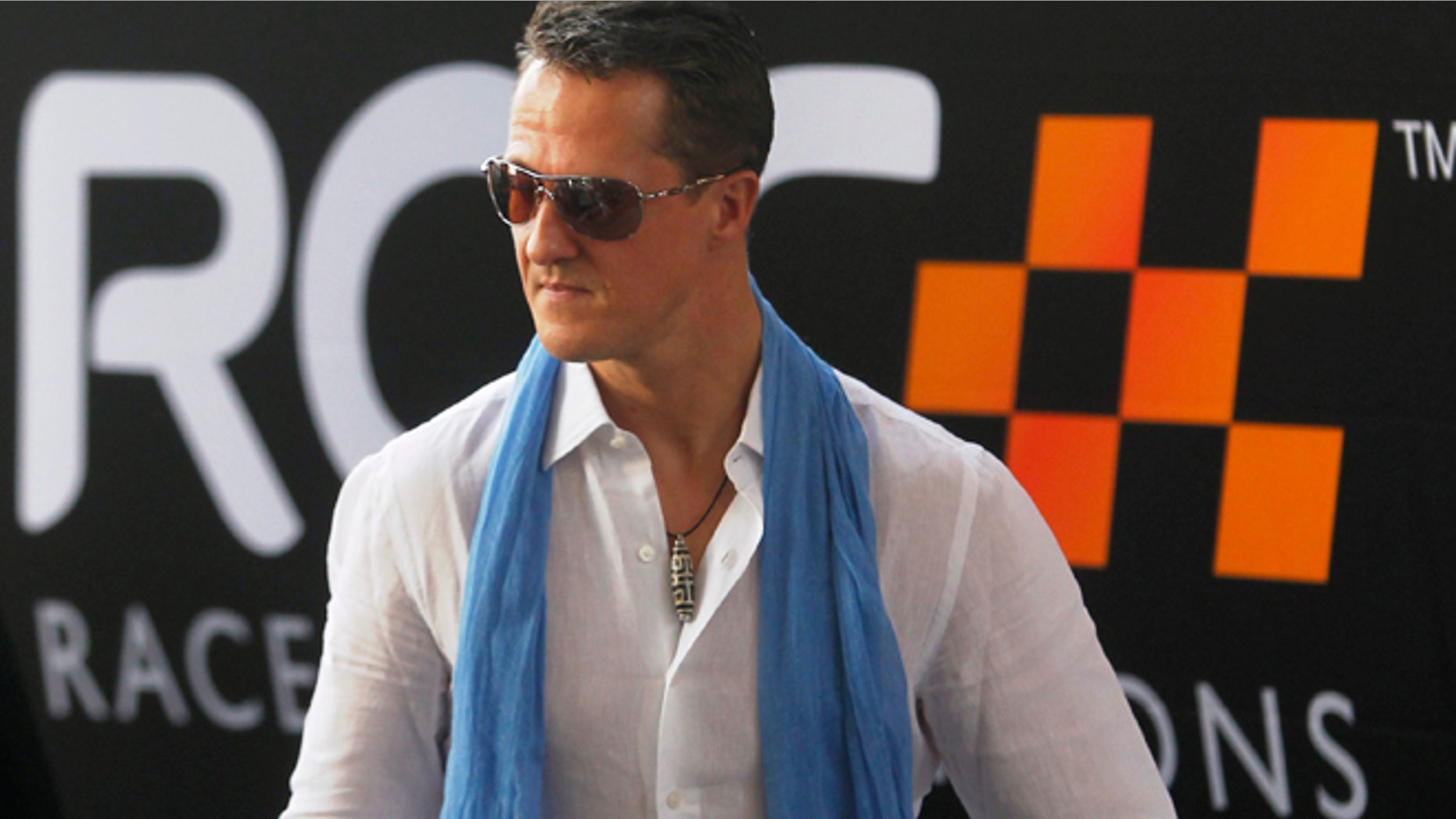 Driver Michael Schumacher from Team Germany arrives at the Rajamangala National Stadium before a practice for the Race of Champions (ROC) in Bangkok December 16, 2012. The Race of Champions runs from December 14 to 16. REUTERS/Chaiwat Subprasom (THAILAND - Tags: SPORT MOTORSPORT) - RTR3BML4