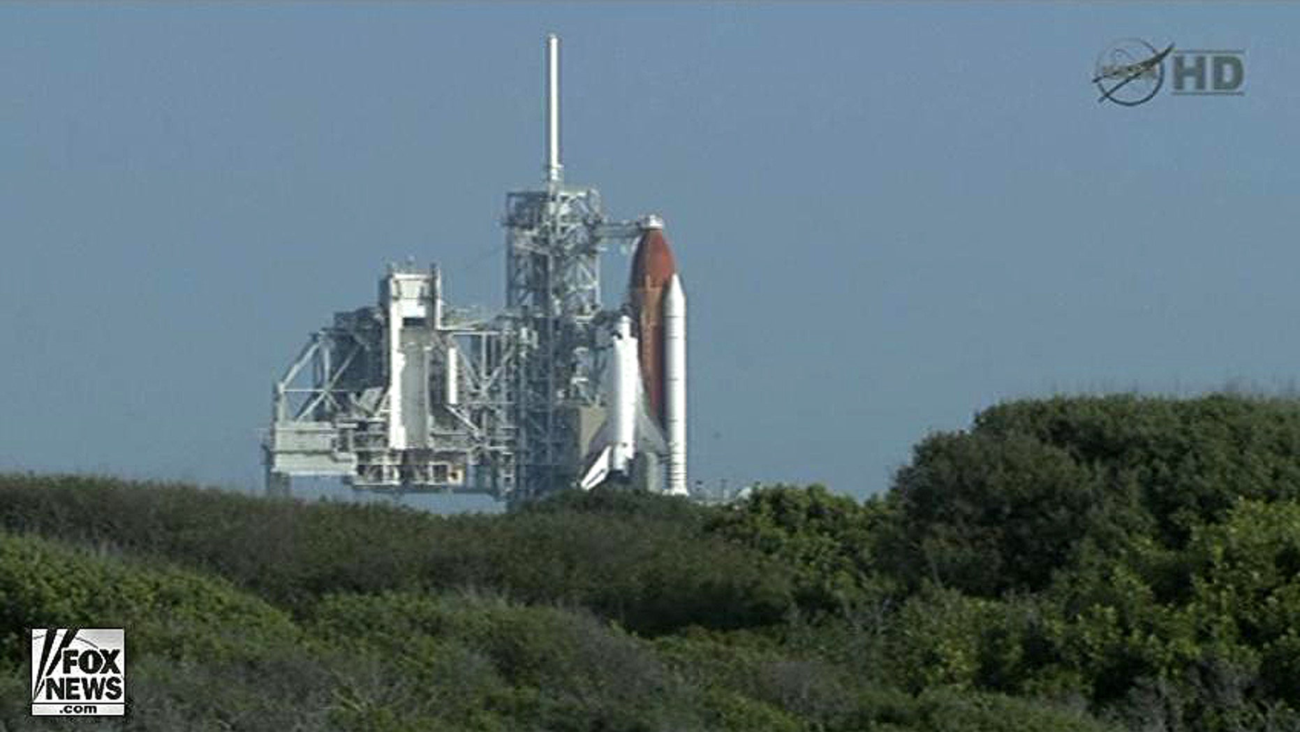Space shuttle Endeavour sits on the launchpad awaiting blast-off on its final mission, STS-134.